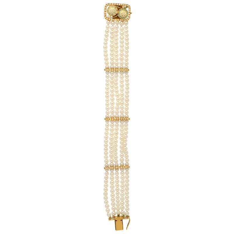 A Masriera original, this bracelet features 0.50 carats of VS clarity E-F color diamonds. The pearls are 3.75MM each and perfectly round. Enamel work on the top clasp, set in 18K yellow gold.  
