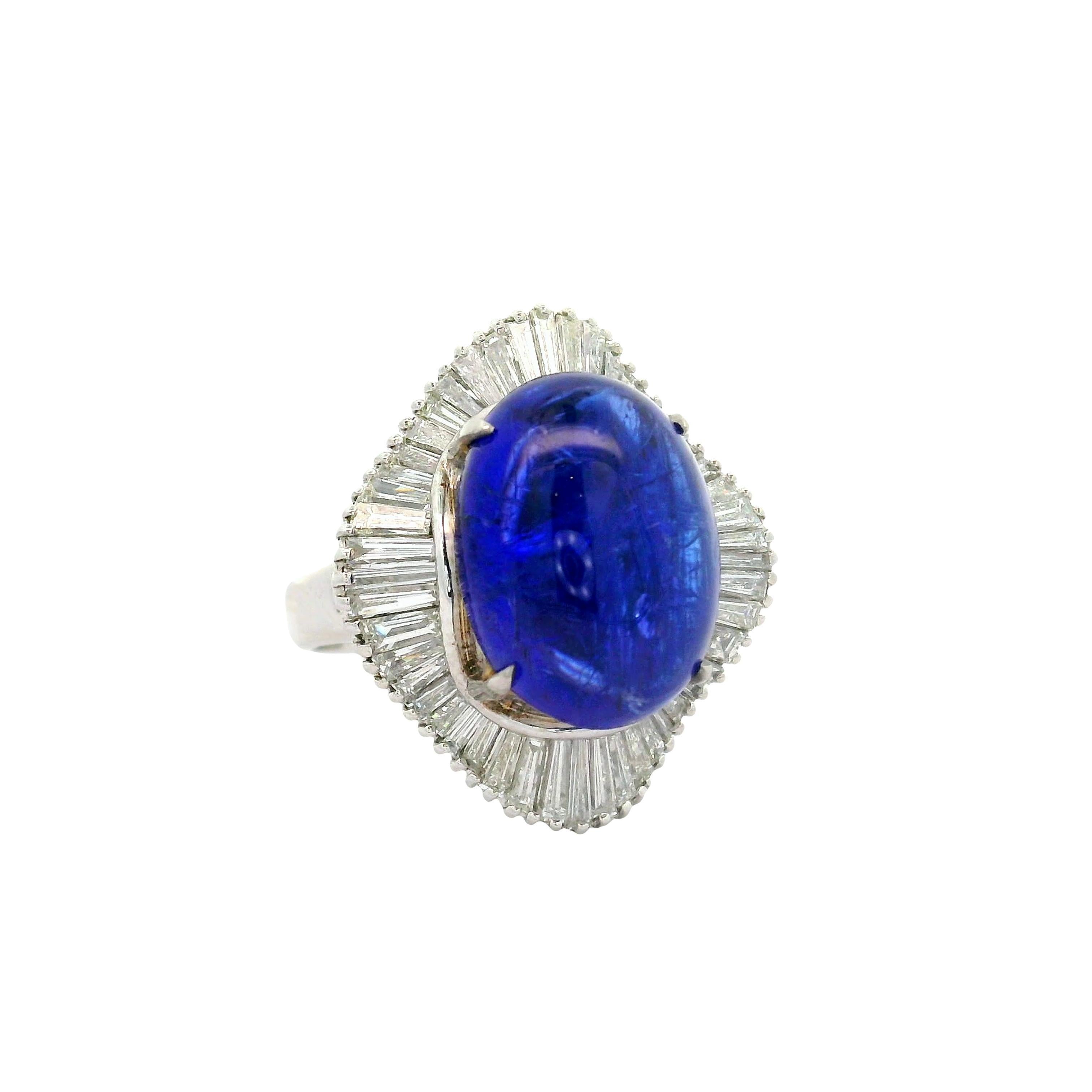 A contemporary fashion ring showcasing a captivating 9.16 carat tanzanite as its centerpiece. The stone displays a deep blue color with a slight hint of purple, mesmerizing the eye with its rich hue. Encircling the tanzanite are 1.85 carats of