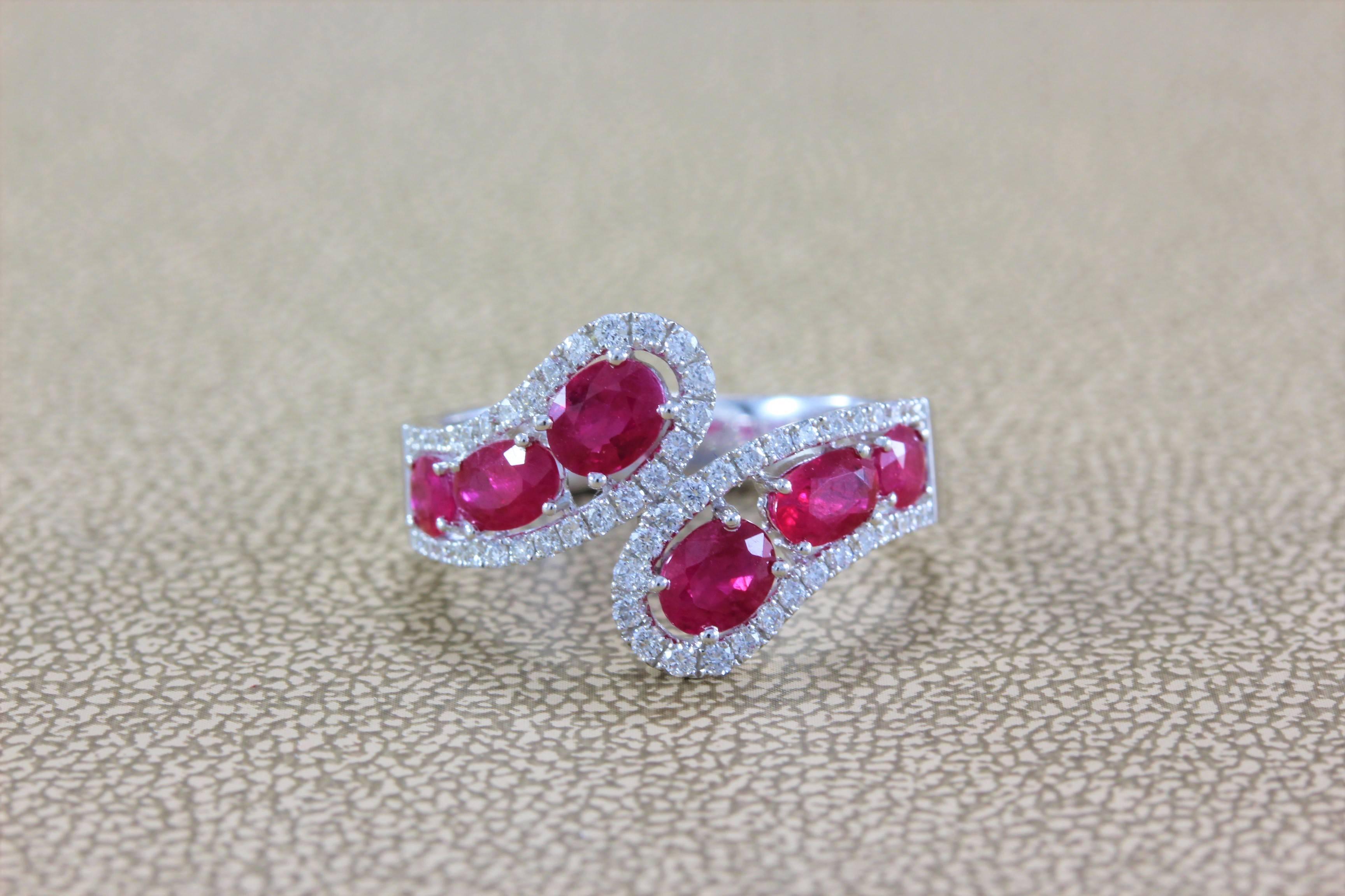 A sleek and sexy bypass ring featuring 1.87 carats of deeply saturated vivid red ruby accented by full-cut VS colorless diamonds all set in 18K white gold. 

Simple yet unique, the ring can be worn every day or dressed up for an evening out. 

Size