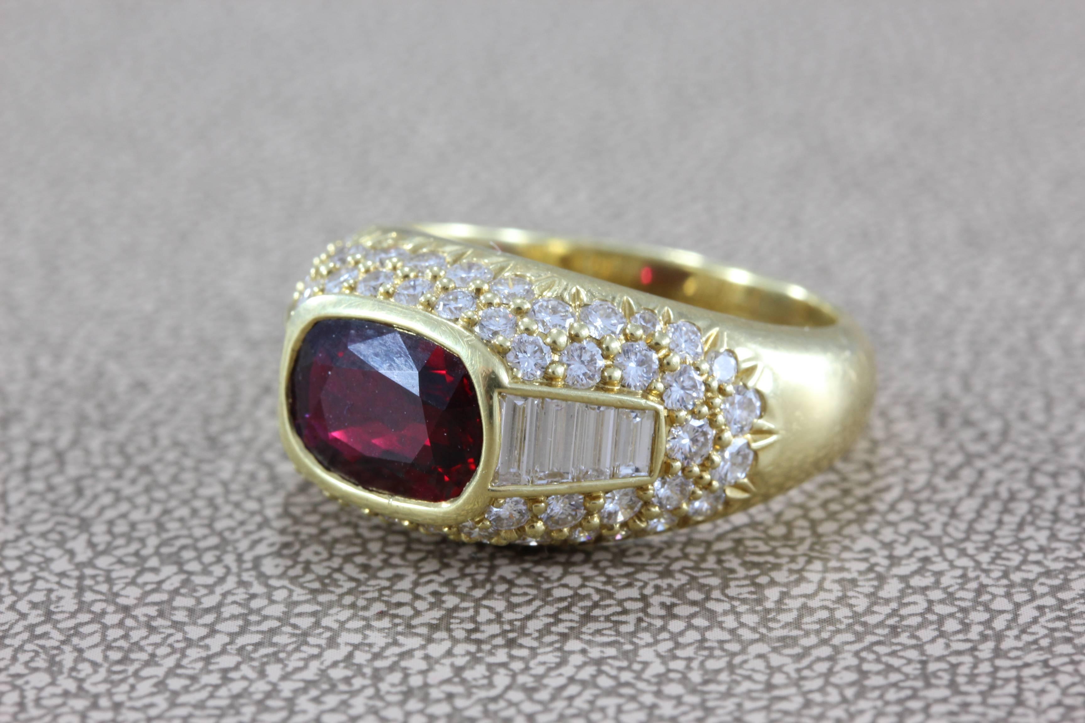 A classy gold cocktail ring featuring a 2.48 carat ruby with deep vivid red color. Accenting the center stone are 3 carats of VS clarity colorless diamonds in baguette shape as well as full-cut rounds, all set in 18K yellow gold. 

Size 7 (sizable)
