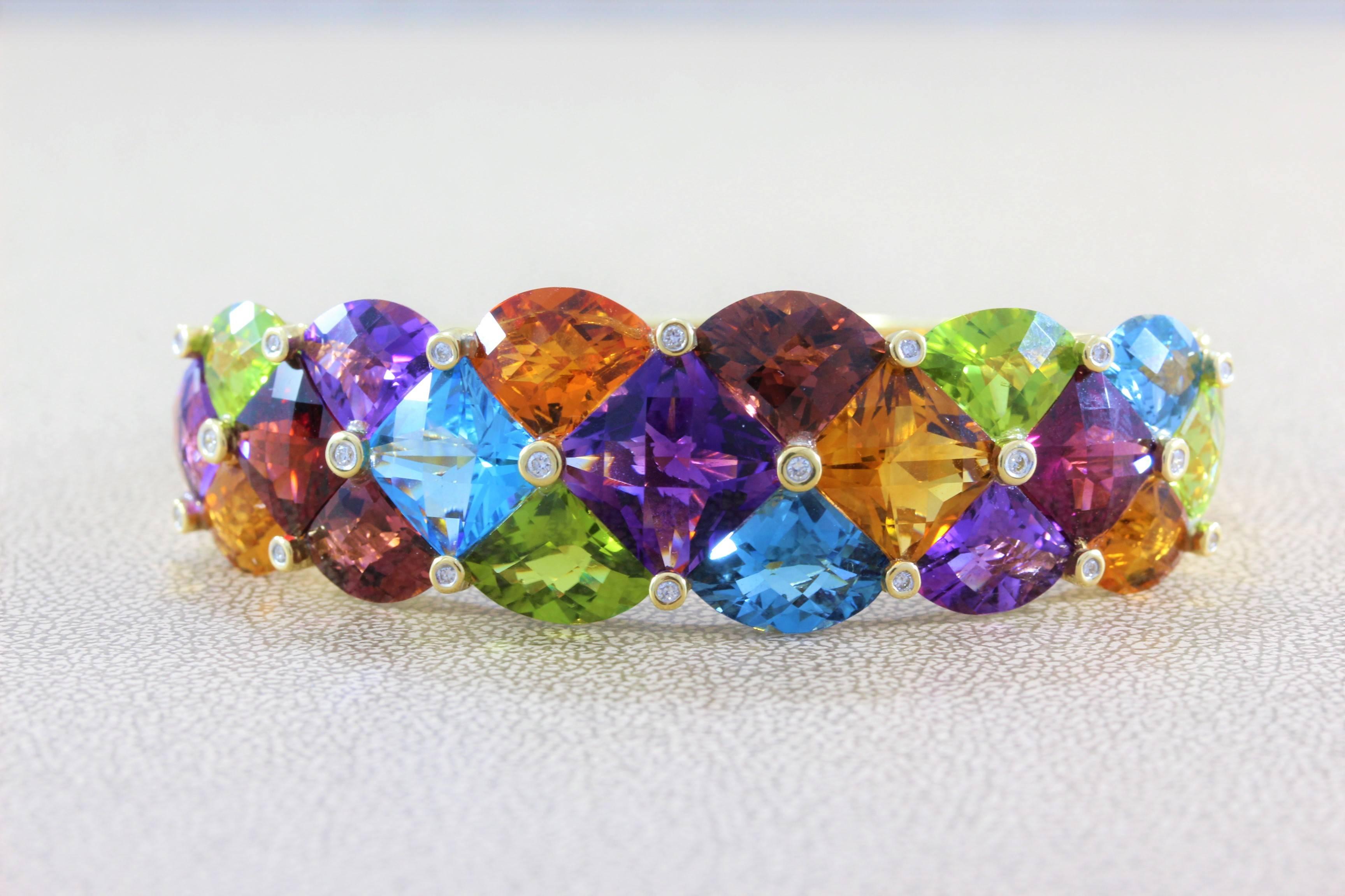 A Bellarri original this bracelet features over 40 carats of multi colored gemstones including peridot, amethyst, garnet, citrine and topaz. Accenting the colored stones are 0.36 carats of diamond, all set in 18K yellow gold. 

Size 6.5 inches  
