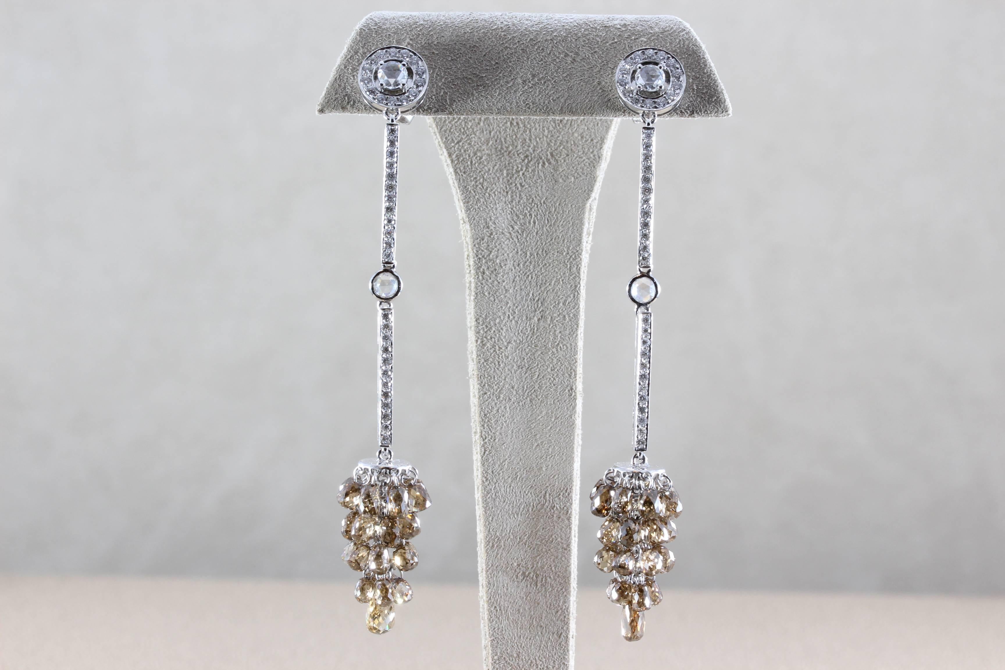 A fun and sexy pair of chandelier earrings featuring 22.03 carats of fancy colored briolette cut diamonds. Accenting the chandelier are 1.66 carats of white diamonds, set in 18K white gold. 

Length: 3 inch
Total Weight:15.5 grams

