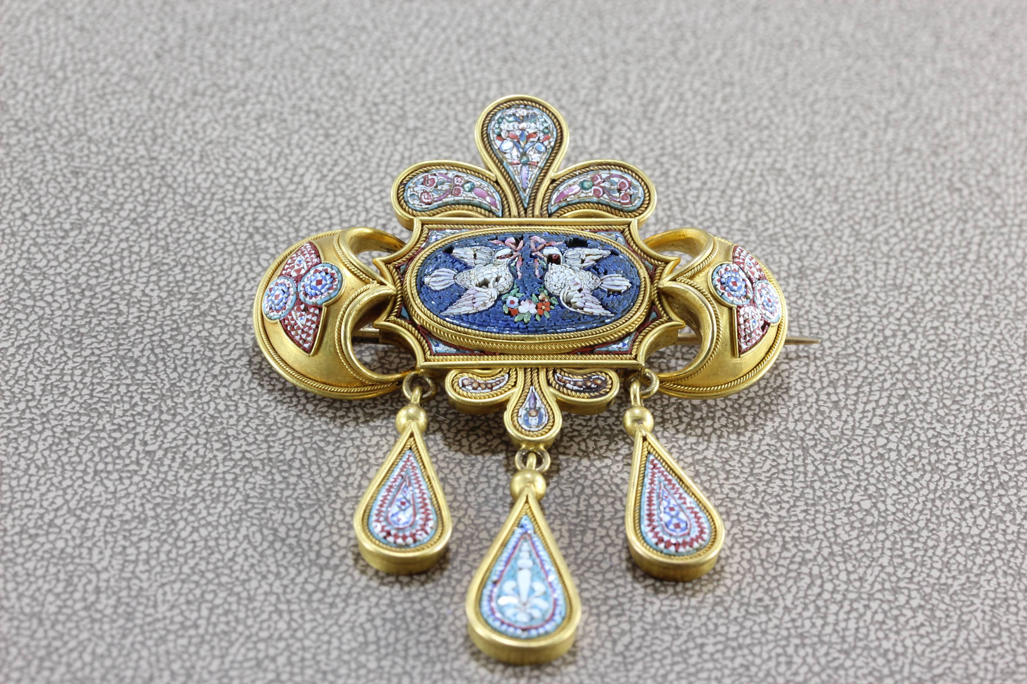 A lovely example of micro-mosaic work mastered in Rome during the mid-19th century. Colorful and highly detailed, this brooch depicts two doves coming together to make a home. Over a thousand pieces of mosaic were used to craft this intricate and