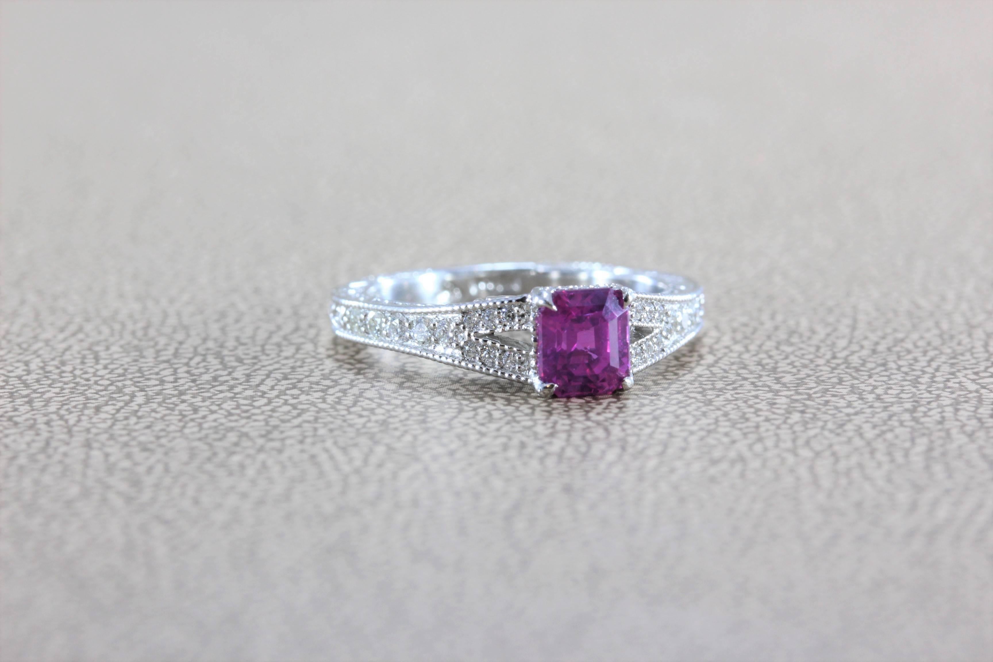 This ring features a superb top gem quality deeply saturated vivid pink sapphire. Such deep and even color is rarely found in gemstones, even of this size. Diamonds accent the center stone, set in platinum, with milgrain setting on this antique