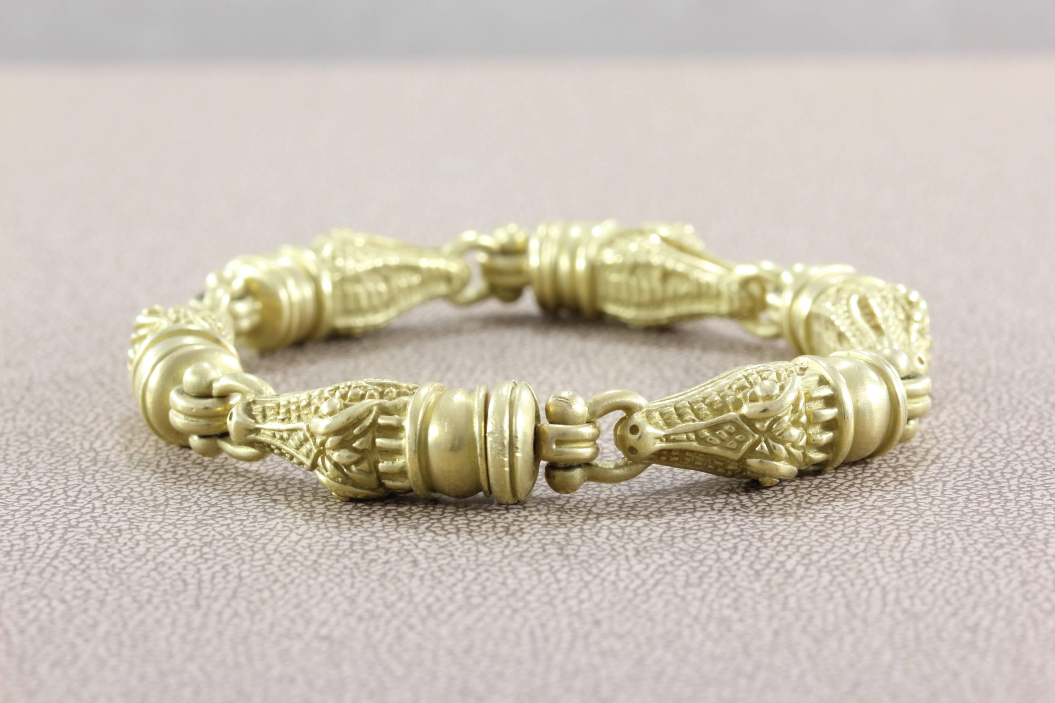 A Kieselstein-Cord original, this alligator bracelet is made in 18K yellow gold with six links. Each alligator is signed Kieselstein-Cord, length 7 inches.