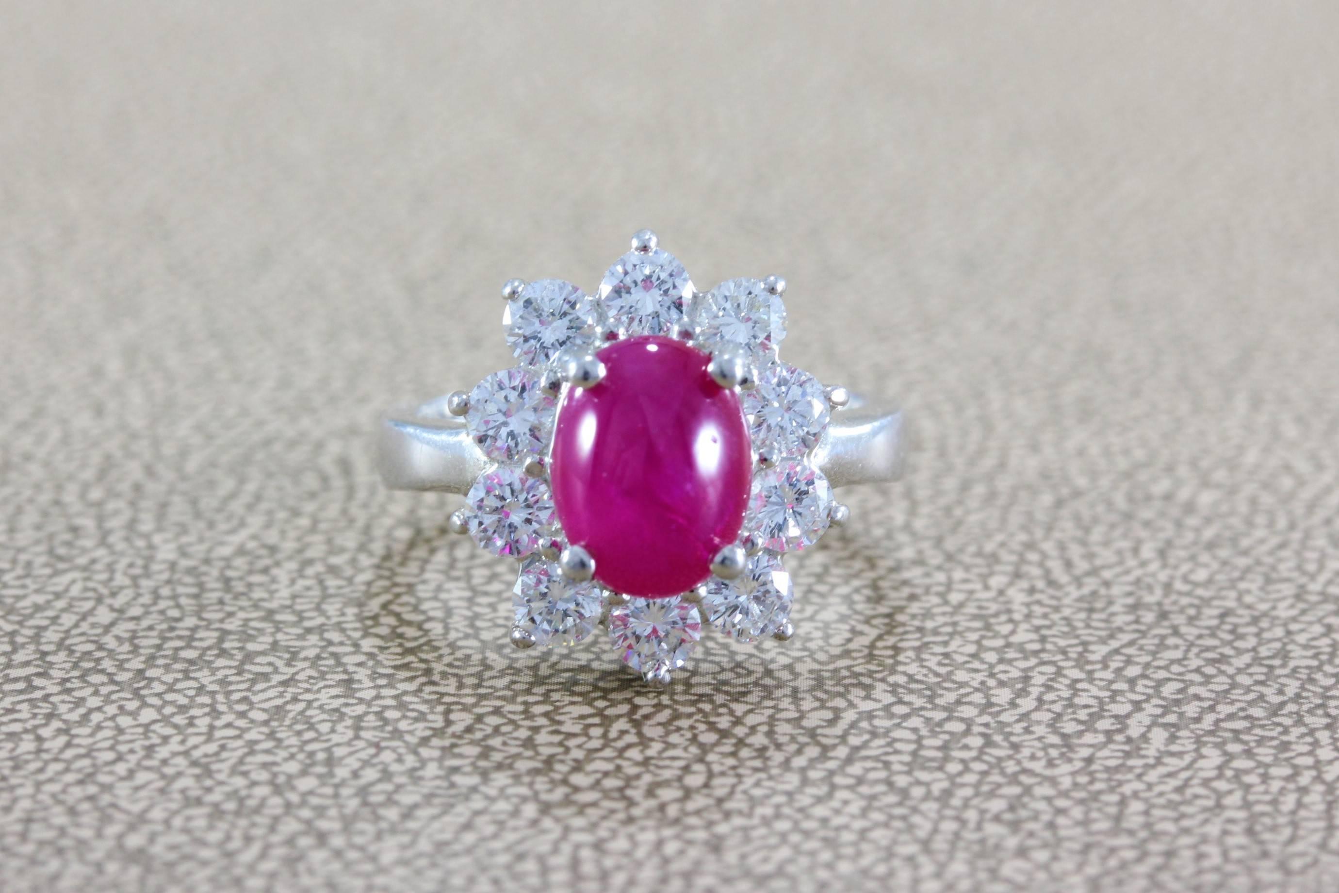 A breathtaking ring featuring a GIA certified 3.00 carat cabochon Burma ruby surrounded by 1.00 carat of dazzling round cut diamonds in a platinum setting. Since the start of recorder time Burma (Myanmar) has been the source of the fines quality