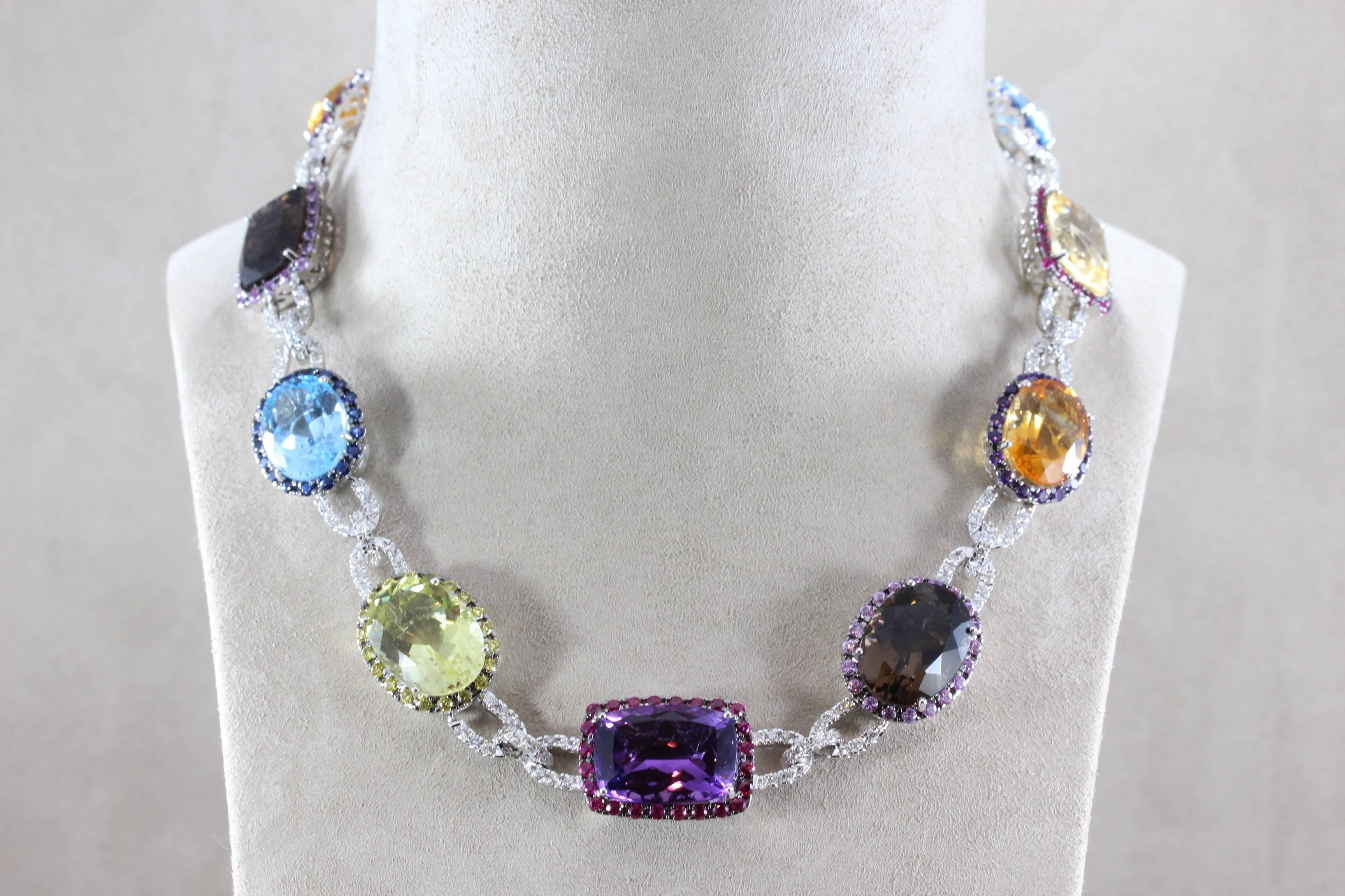 This magnificent necklace features over 100 carats of multi colored gemstones which include amethyst, topaz, citrine, ruby, sapphire and others with 3 carats of diamonds set in 18K white gold. A well crafted evening necklace full of color and