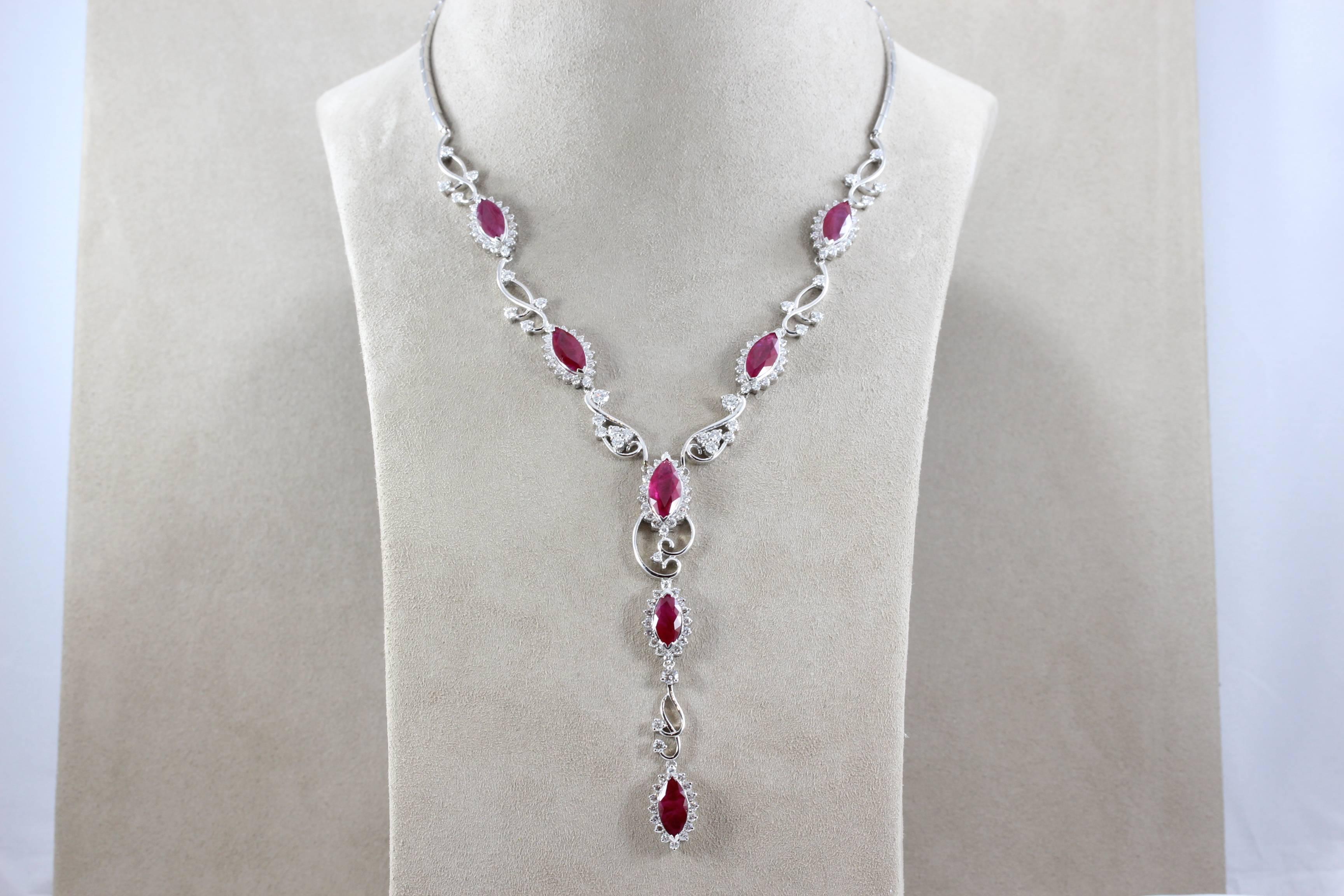 A sexy gold necklace featuring 7 large marquise shape rubies weight about 2 carats each. There are over 5 carats of VS quality diamonds set in 18K white gold which accent the vivid red ruby. A necklace to match the perfect outfit. 

Necklace Length: