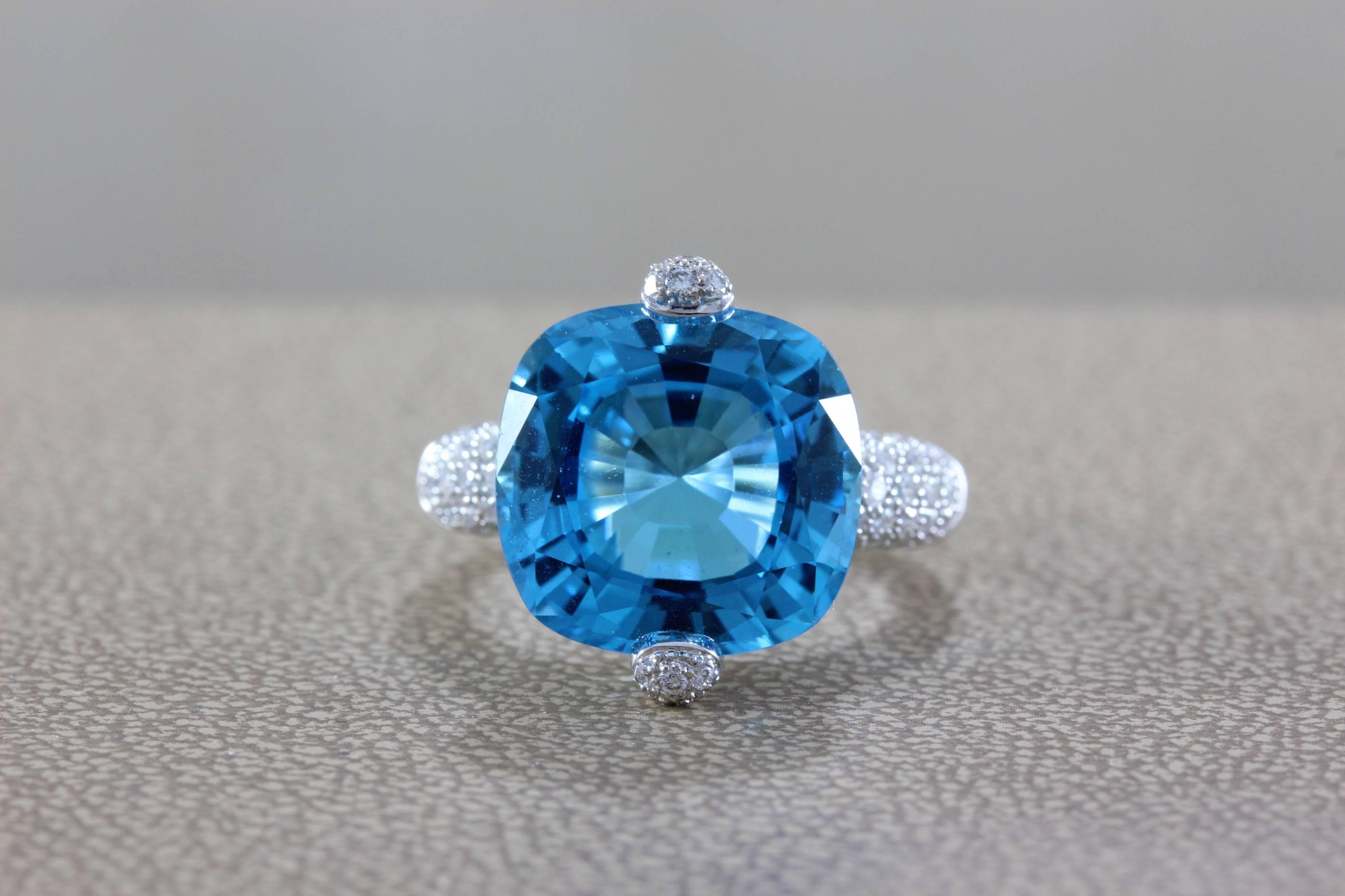 A vibrant 11.82 carat cushion cut blue topaz ring, uniquely set with two prongs.  The mounting features 0.94 carats of VS quality diamonds pave set in 18K white gold.  The craftsmanship and design of the ring is truly one of a kind.

Ring size 6 ½
