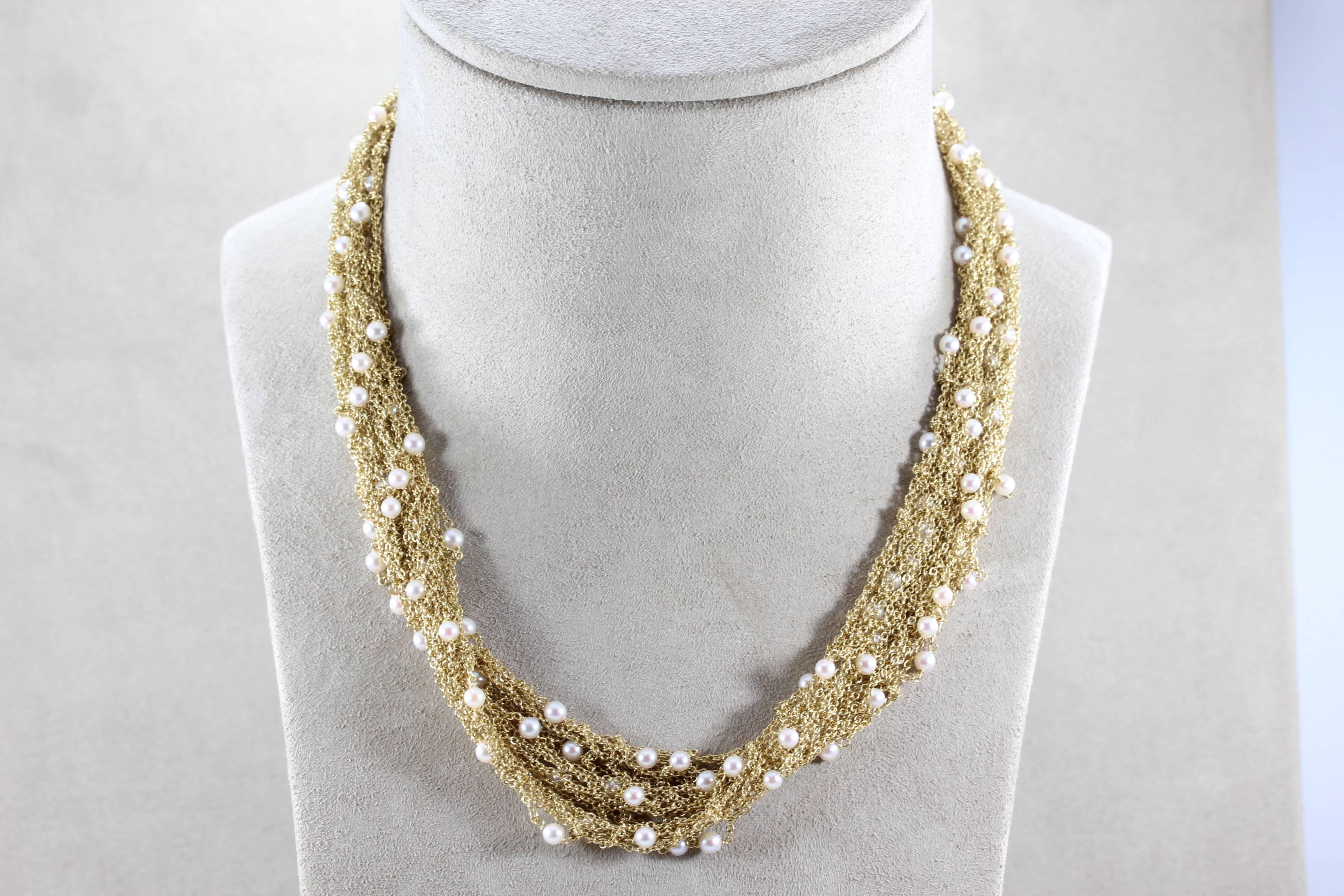 A delicate choker with seed pearls throughout a handmade 18K yellow gold soft mesh necklace. Handmade in Italy with fine craftsmanship and a seamless twist lock to secure its closure, a piece you will want to wear everyday. 

Length: 16 inches
