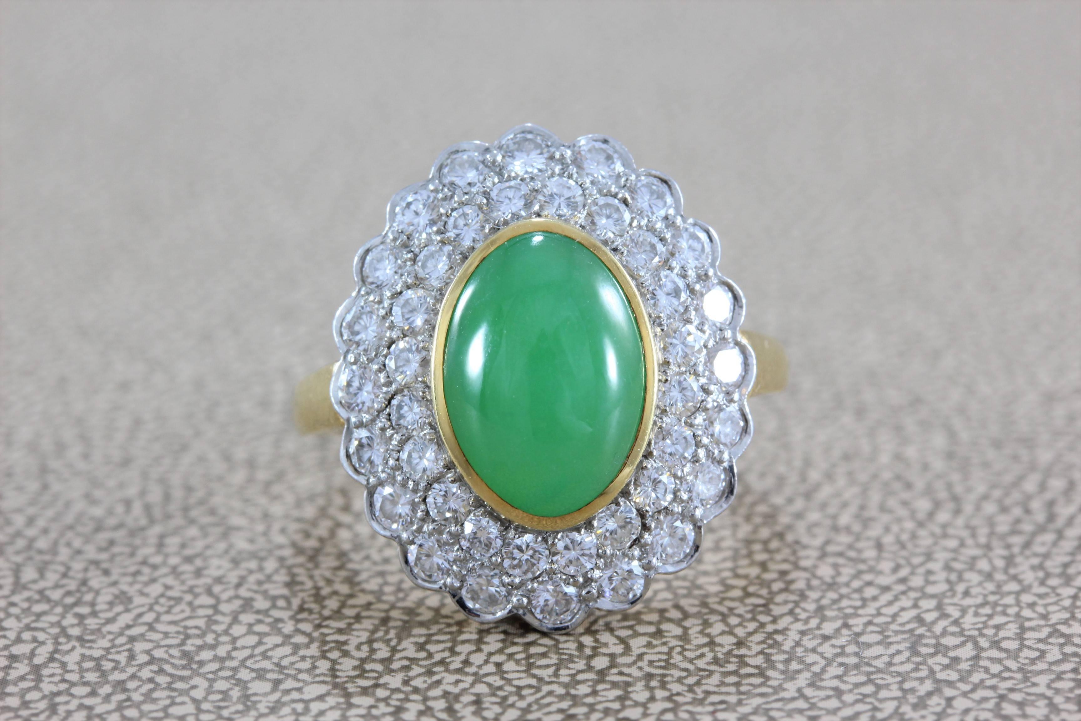 A lovely piece by Gumps, this ring features a 2.55 carat molted green translucent piece of natural jadeite jade. Accenting the jade are over 1 carat of round cut VS quality diamonds set in 18K yellow gold. Signed Gumps.

Size 6 ½ 
