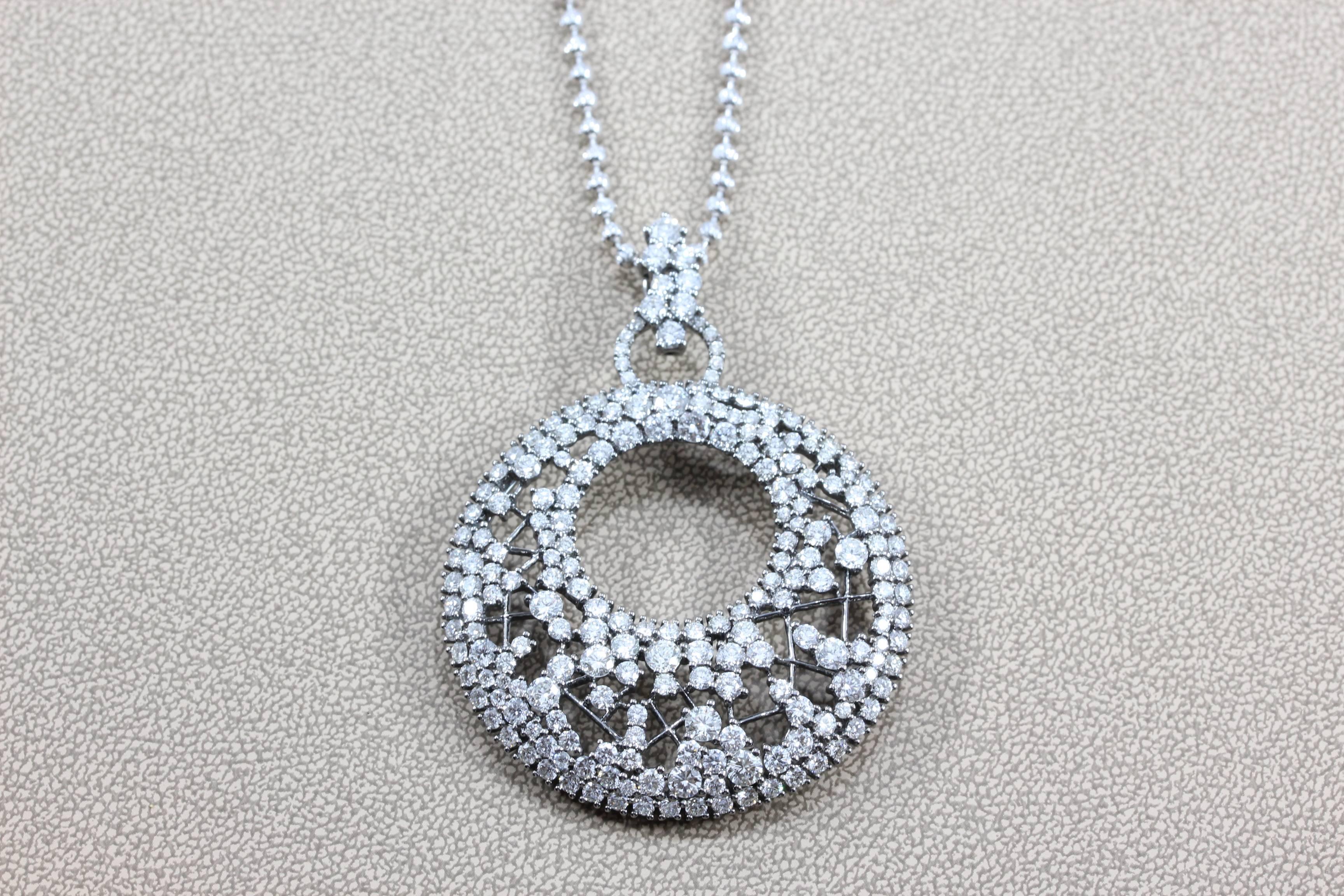 11.76 carats of near colorless and VS quality diamonds are set in this specially designed pendant.  This intricate pendant is sure to rock any outfit, day or evening.  The chain is 18K white gold and the pendant is 18K black rhodium gold.  

Chain