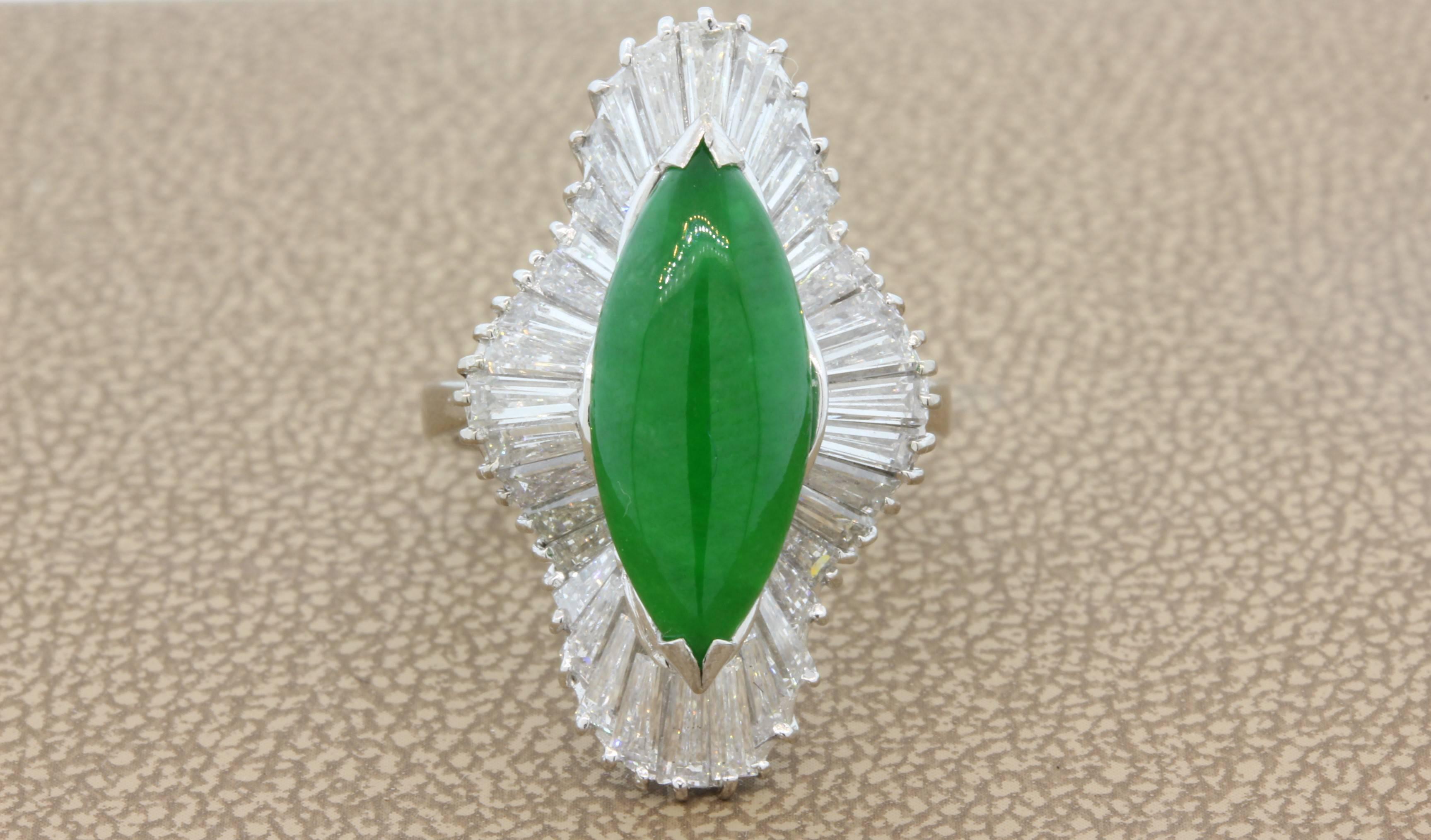 A gorgeous ring featuring a fine translucent 2.60 carat jadeite jade. It has a Mason Kay laboratory report certifying the jade as Grade A.  The beautiful apple green color jade is set with 2 carats of fine quality baguette cut diamonds in an 18K