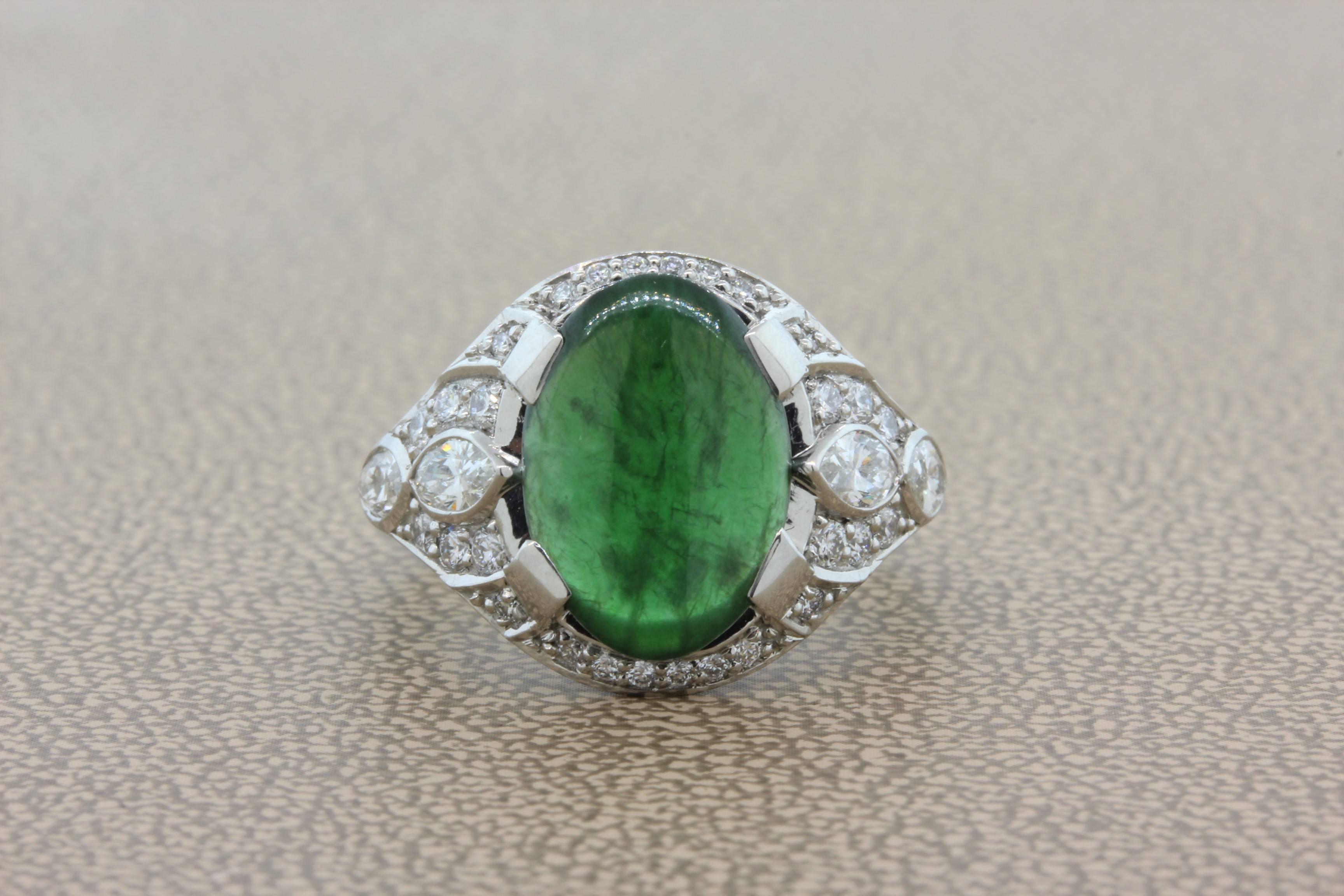 An antique inspired ring featuring fine natural jadeite jade set in a handmade platinum mounting. There are 0.90 carats of marquise and round cut diamonds to accent the jade. 

Size 6 ½ 

