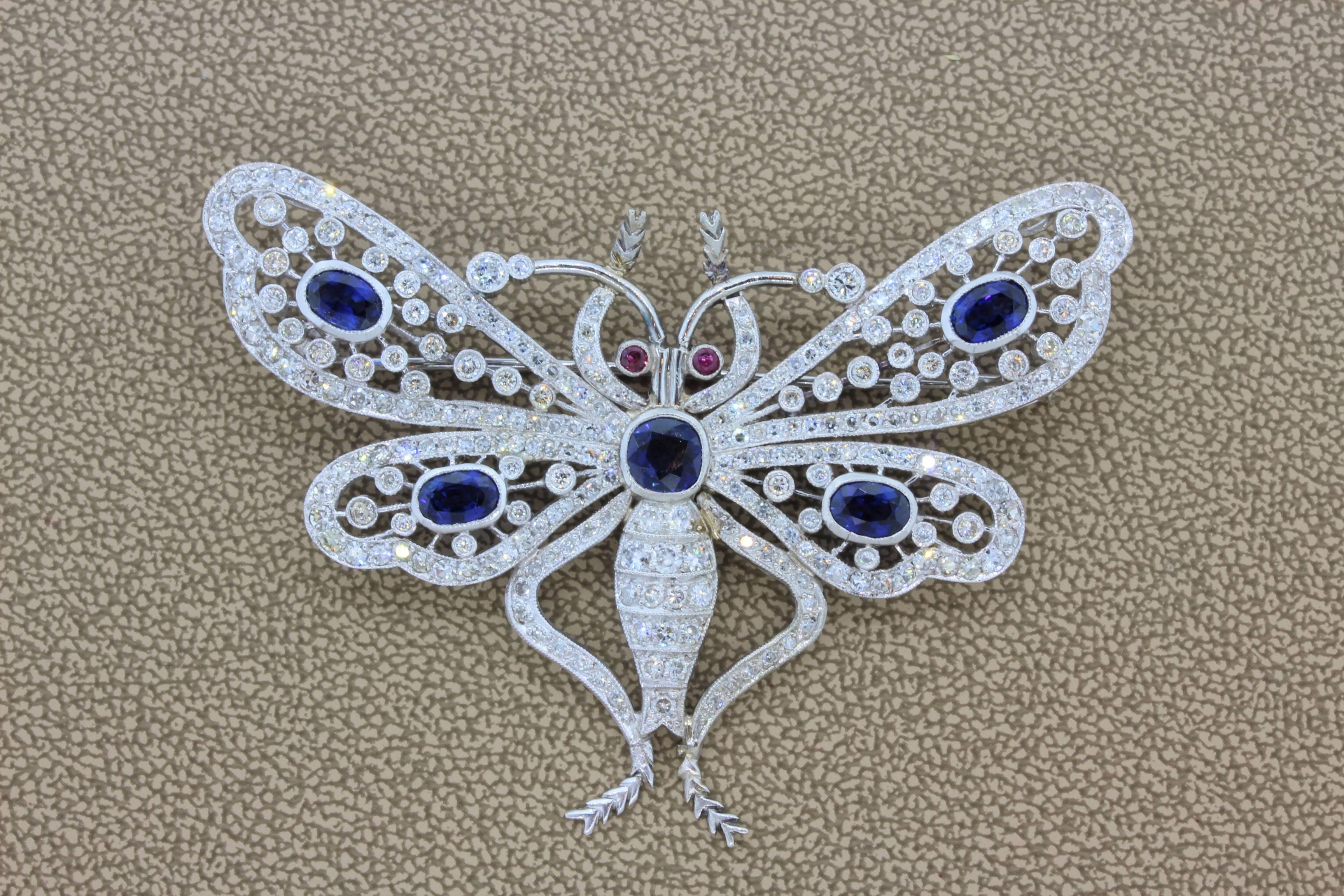 A stunning Art Deco pin brooch from the 1930’s that is impressively made with extreme quality, as seen in the settings work on the back and front of the brooch. It features 4.40 carats of round cut diamonds and 5 gem quality blue sapphires weighing