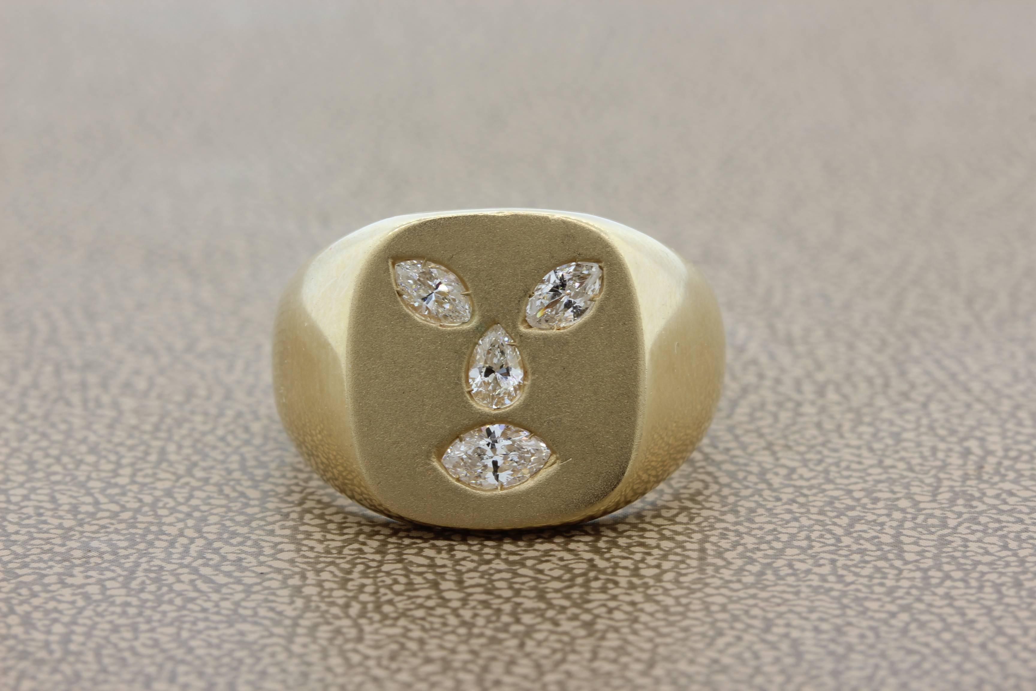 A unique ring featuring 4 diamonds, 1 pear cut and 3 marquise, set in 14 karat yellow gold. The 4 diamonds are all VS quality and weight a total of 0.50 carats.

Size 9 ¾ 
