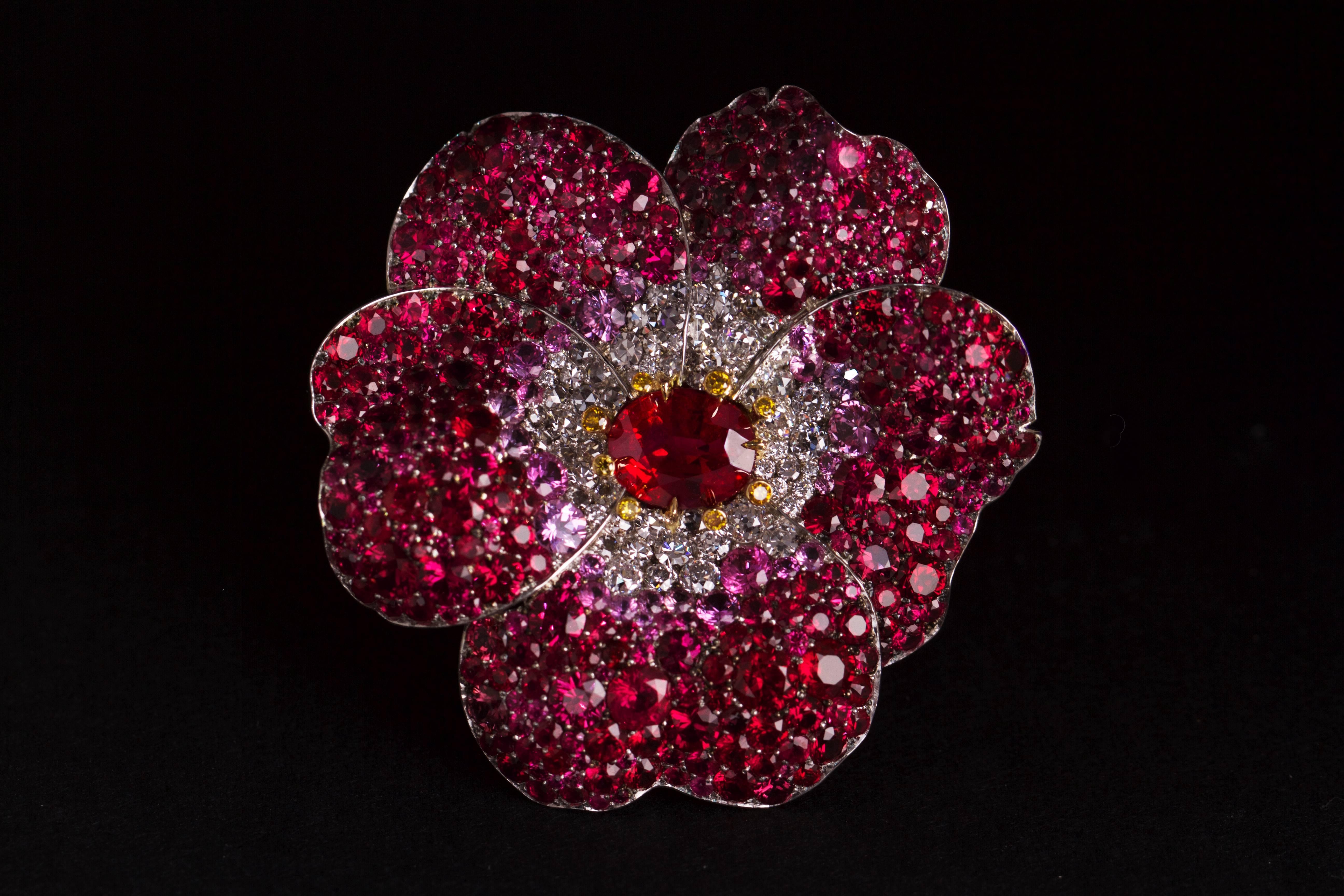 Stunning and rare Burmese Ruby Ring by David Michael. One of a kind piece hand made in Platinum. Oval cut Burmese Ruby 2.29cts ( GRS Cert, Pigeons Blood ). 
The petals feature pave set mixed cut white diamond melee ( 1.47 cts ), natural yellow