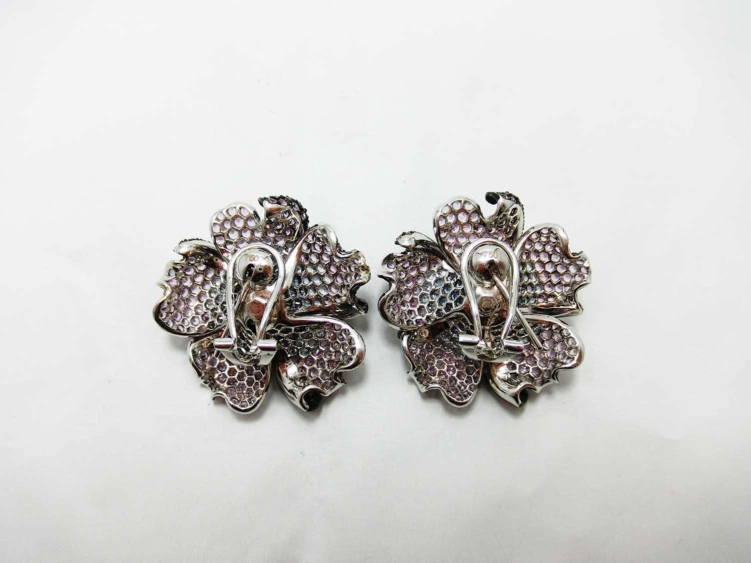 Big Mun flower earrings made in 18k White gold.We shaded color in purple sapphire and sapphire to make the piece in very sweet looking.We use many shades of color sapphire to make a beautiful combination.Our workmanship is very in detail and the