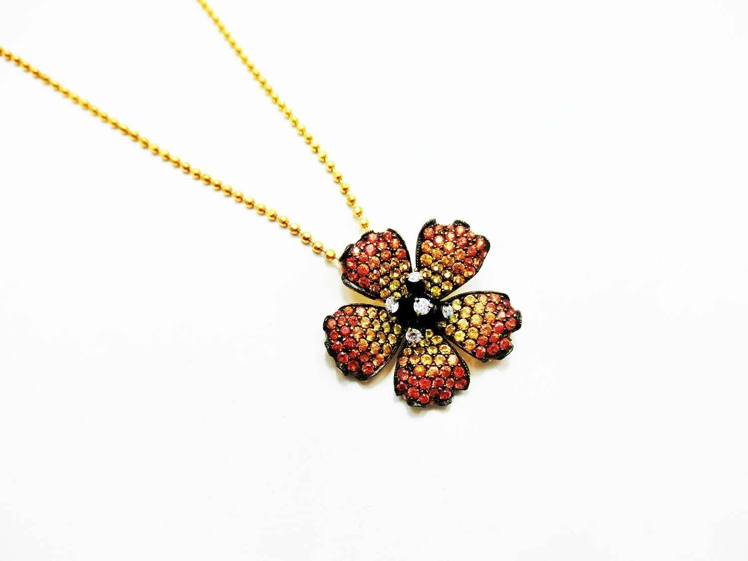 Poppy flower pendant made in 18k Gold .It shade color form light to dark yellow sapphire.Yellow and Orange sapphire is 2.57 ct High quality sapphire,
Diamond 0.14 ct H VS quality This pendant is include the 18k gold chain.