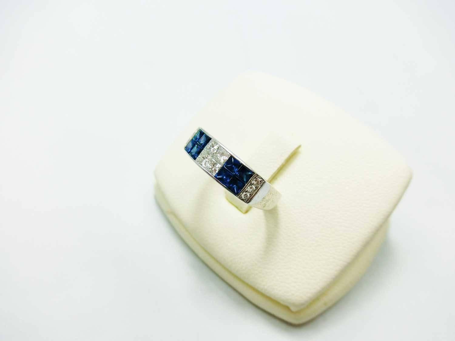 Sapphire ring made in 18k Gold.We set as invisible setting in high quality workmanship.Sapphire 1.02 ct
Diamond 0.38 ct G-H VS quality
Now ring size 6 US size .We can adjust to your size .
