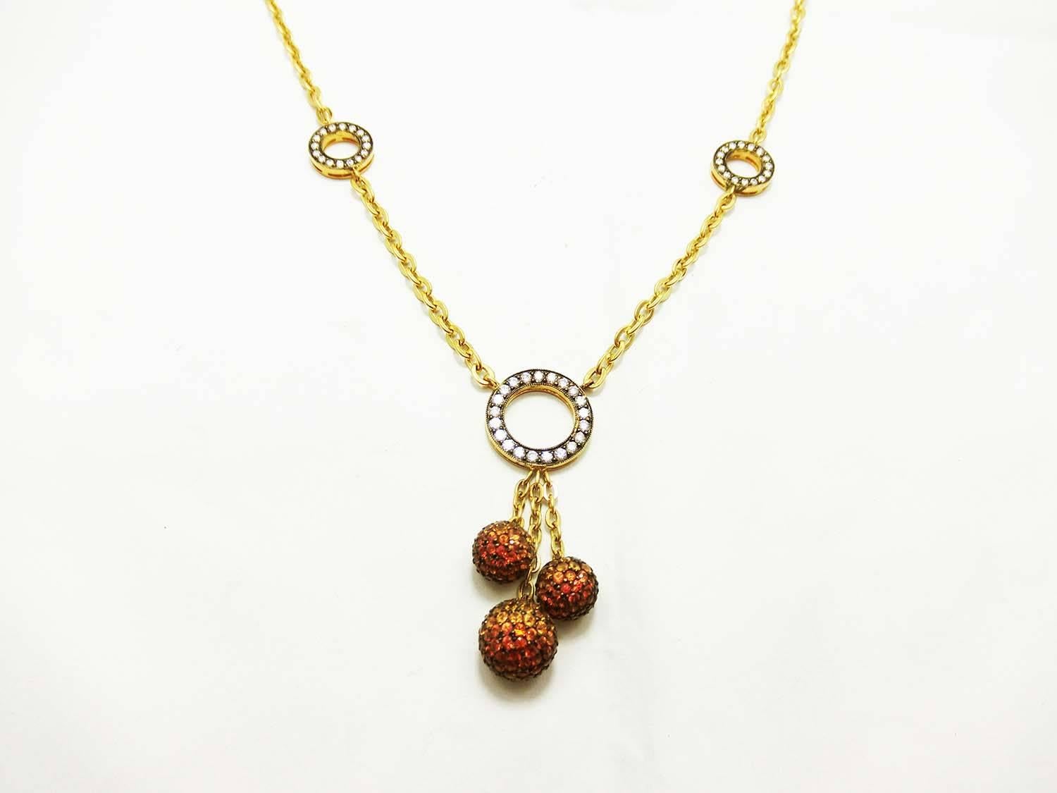 3 Balls necklace made in 18k Yellow gold.We design as the harmony symbolic.
Orange and Yellow Sapphire 4.13 ct 
Diamond 0.96 ct H VS quality
The length is 16.5 inches but you can use as 15 inches,16 inches and 16.5 inches .Because we have a small