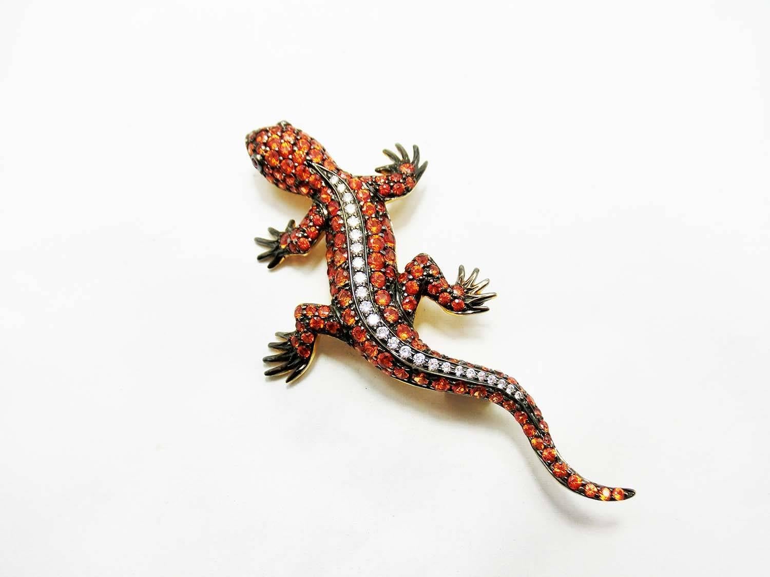 Gecko brooch made in 18k yellow gold.We design as the inspiration of traveling to the jungle and see the Gecko.So I feel it look powerful.
Orange Sapphire 6.81 ct high quality orange sapphire
Diamond 0.48 ct H Vs quality