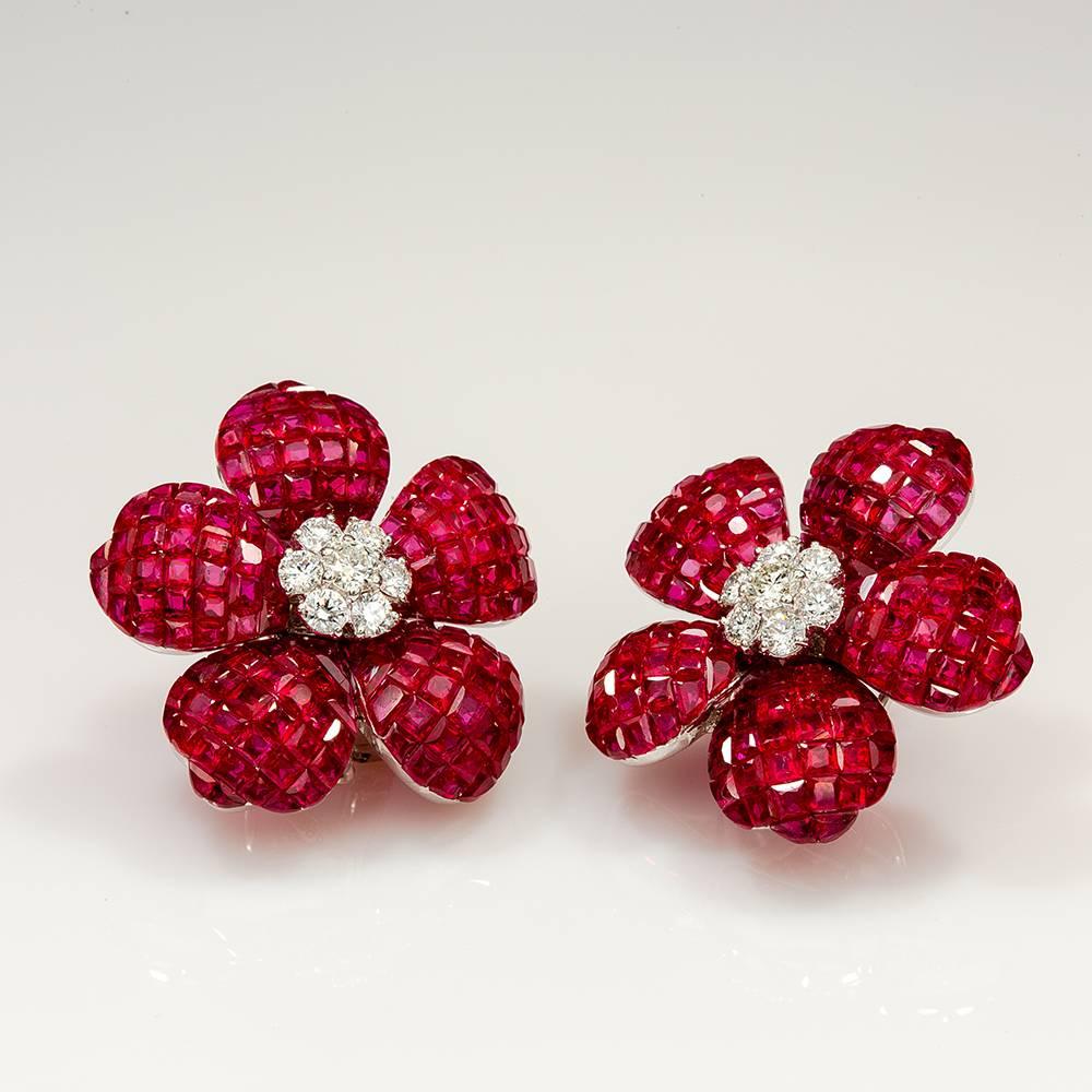 Ruby invisible Flower Earrings use the top quality of ruby which make in invisible setting.We set the stone in perfection as we are professional in this kind of setting more than 40 years.The invisible is a highly technique .We cut and groove every