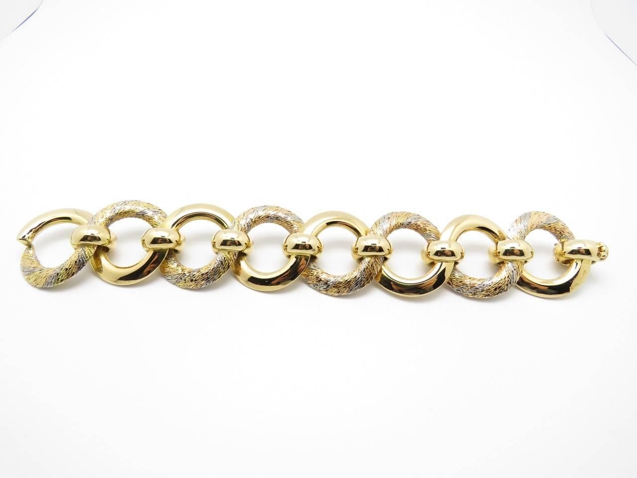 1970s Cartier Paris Three Tone Gold Link Bracelet.
18 Karat gold bracelet.
Rose Gold
White Gold
Yellow Gold
Signed 