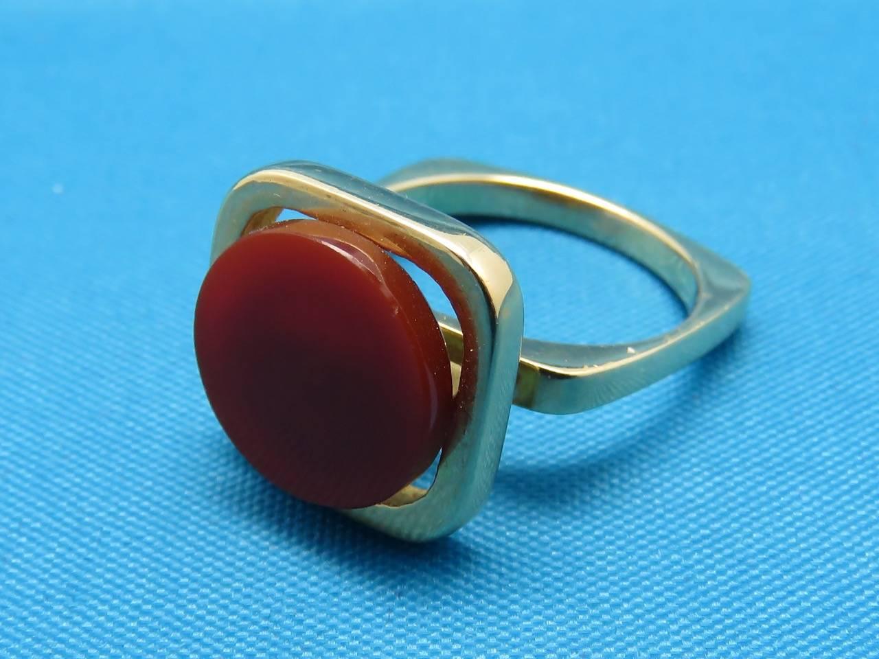 Yellow Gold and Carnelian Ring.
Signed by Pierre Cardin
Circa 1980
Measurements:
Ring Size: 6 
Weight: 7.70 Grams
