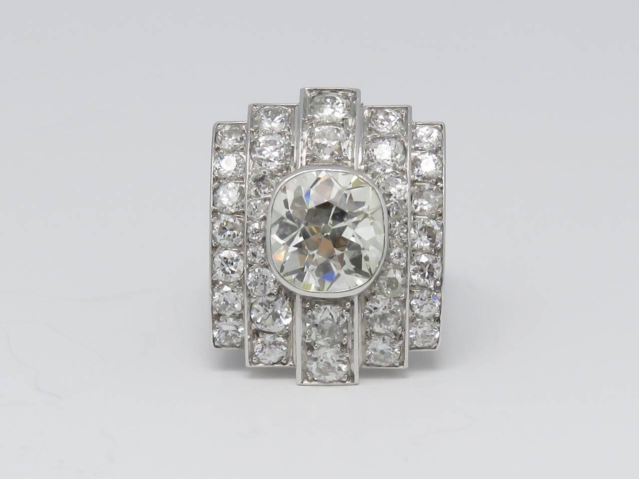 This beautiful platinum Art Deco ring with 1 main  set antique cushion cut diamond weighing approximately 5.00 carats and with approximately 4.00 carats of old european cut diamonds.
Ring Size: 6 1/4      ( T53 )
Measurements: 
Width: 10.24 inches