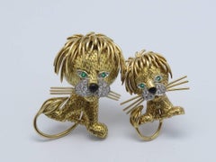 1970s Van Cleef & Arpels "Lion" Diamond Emerald Black Enamel Gold Brooches