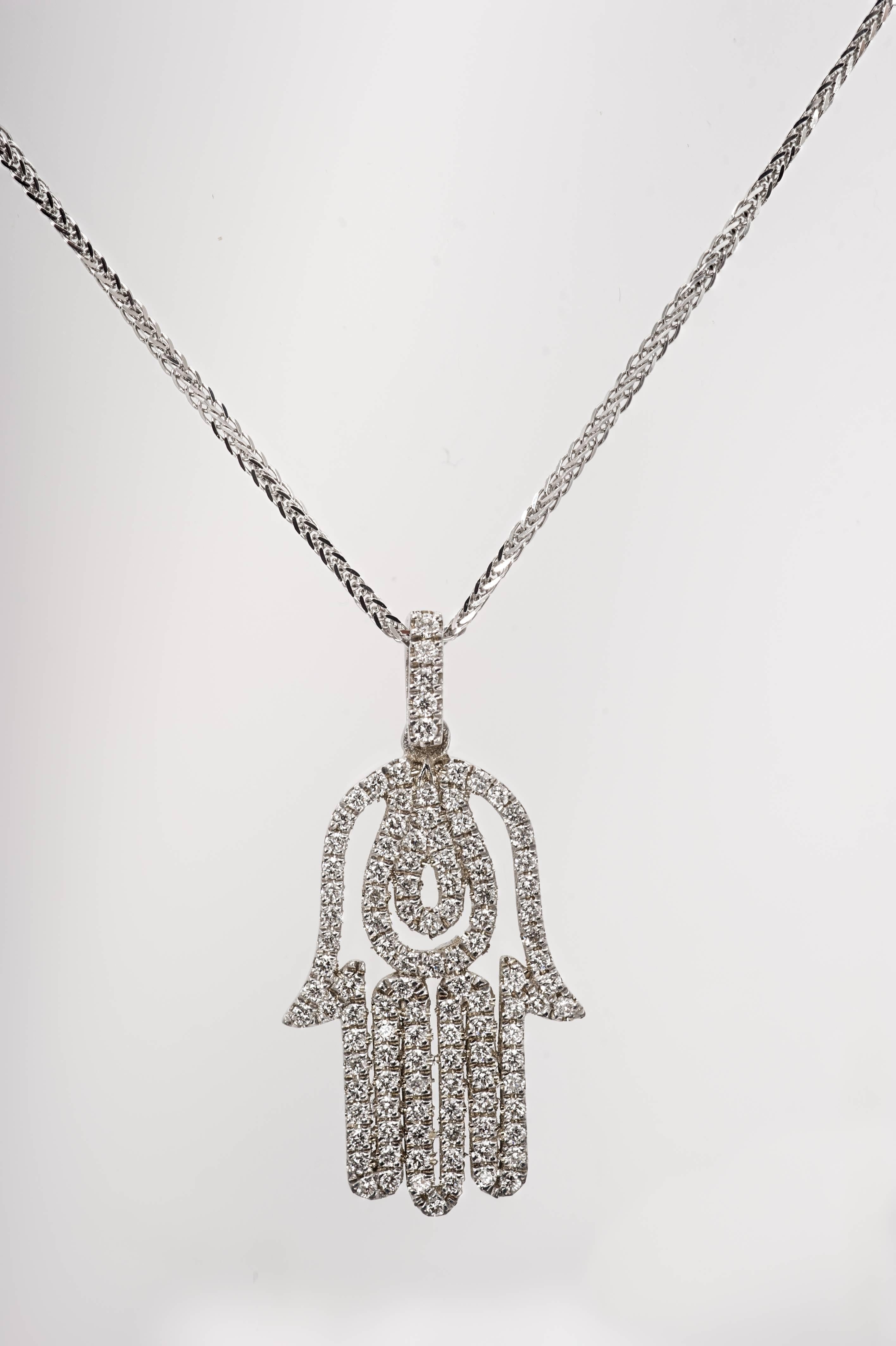 Hand made exquisite Hamsa Necklace pendant. This unique Pendent is set with 0.51 Total Carat high quality Diamonds  E VS. Mounted in 14K white gold. 
The Pendent comes with a  18 inches necklace 14 K white gold. 
Jewel Details: 
14 K White Gold