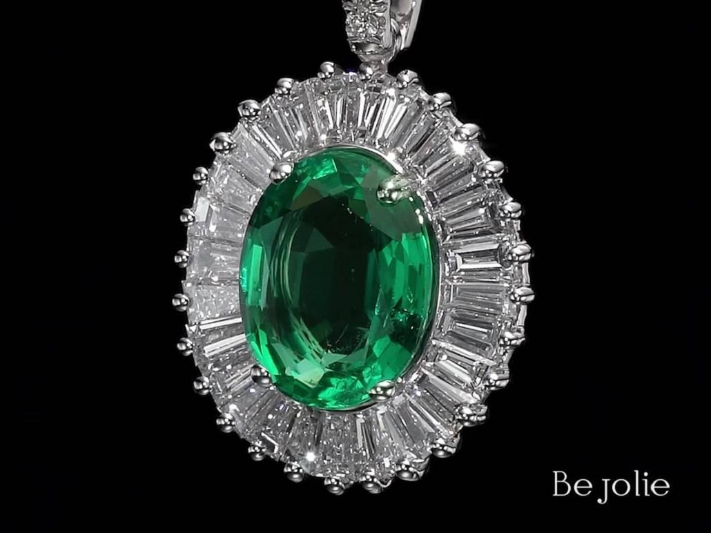 Handcrafted Pendent and necklace featuring 2.18 Carat stunning natural Oval Cut  Emerald.  Our classic emerald surrounds with 28 baguette cut diamonds 1.09 Carat TDW E-G VS , and 5  round brilliant diamonds E-G VS. 
Pendant is mounted on 18 K white