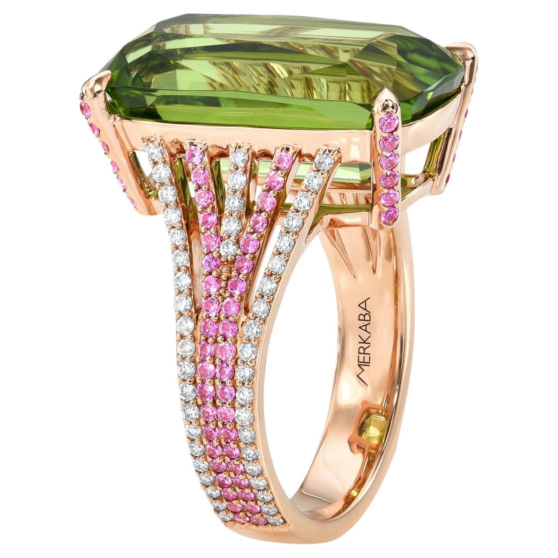 14.40 Carat Elongated Peridot Cushion Ring in 18K Rose Gold with Pink Sapphires & Diamonds – Merkaba Jewelry Beverly Hills -

Indulge in the epitome of luxury with this 14.40-carat elongated Peridot cushion ring, a masterpiece of elegance and