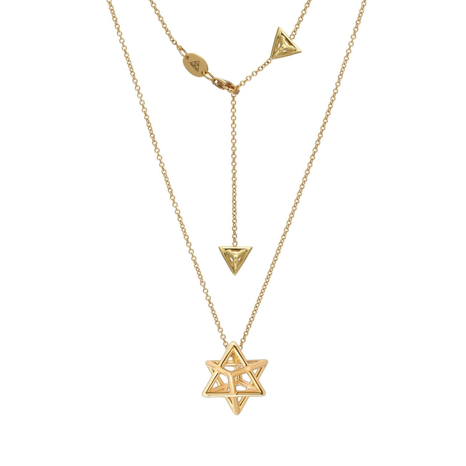 The Merkaba 18K yellow gold necklace, is a heirloom-quality, sacred geometric, three dimensional jewelry piece, highlighting superb attention to detail and extraordinary polish, symmetry and equilibrium. It suspends elegantly at the chest, measuring