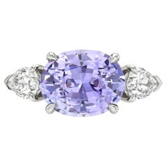 3.32ct Bluish Violet Oval Sapphire & Diamond Three-Stone Platinum Ring – GIA