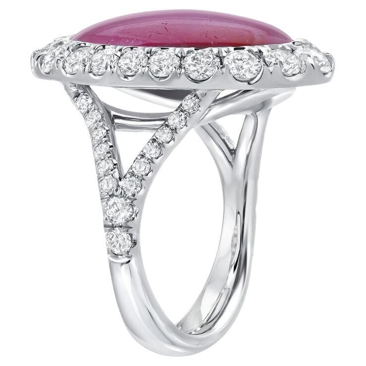 Natural 9.91 carat unheated Star Ruby, displaying distinct and impeccably defined Asterism, surrounded by 48 gradually set, round brilliant diamonds, weighing a total of 1.71 carats, in this magnificent, hand crafted platinum diamond ring.
The total