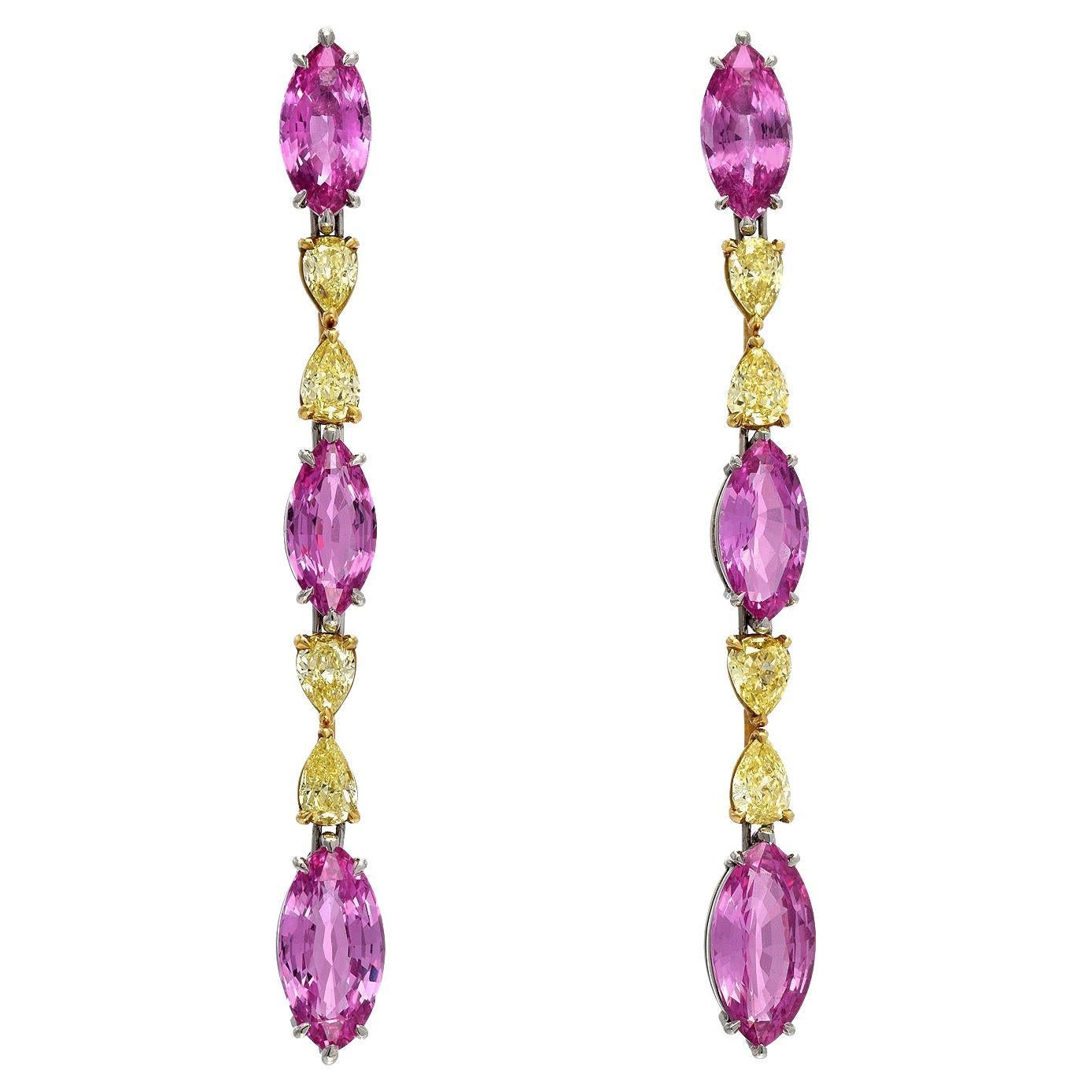 A brilliant pair of platinum and 18K yellow gold Pink Sapphire and Diamond earrings, remarkably set with a total of 10.10ct Pink Sapphire marquise, and a total of 2.00ct pear shaped fancy intense yellow diamonds.
Total length is 2.25 inches.
