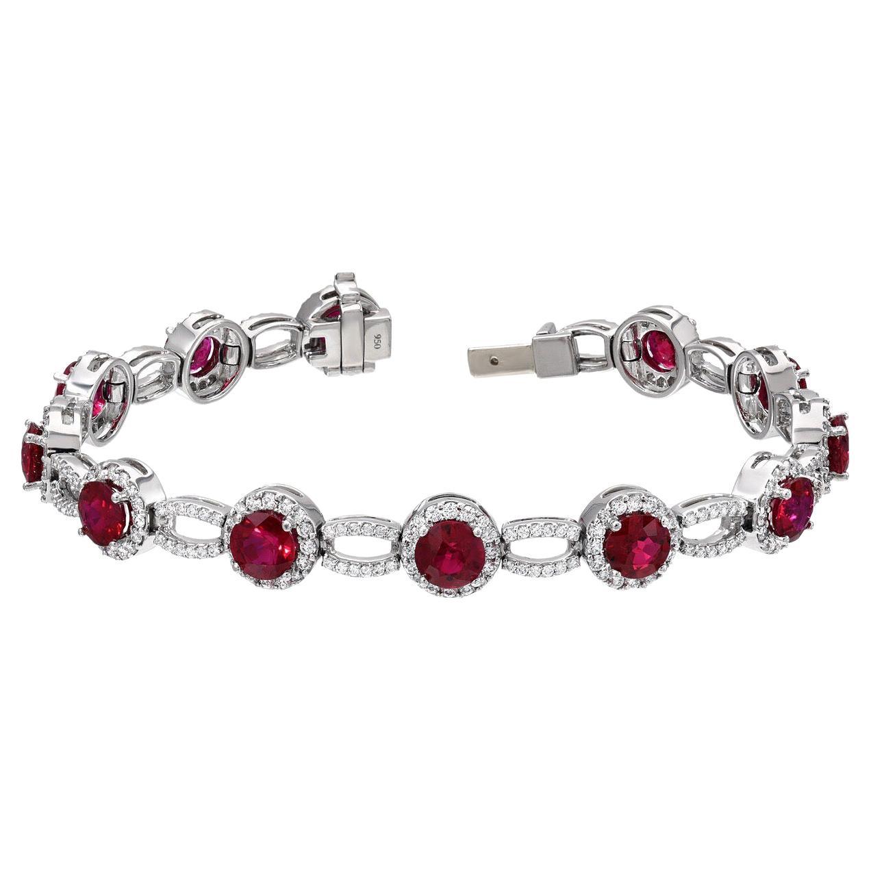 Sensational 9.18 carats total Burmese Ruby rounds, and 1.90 carats total of round brilliant diamonds are hand set in this important platinum diamond bracelet.
6.75 inches long.
This Burma Ruby bracelet set is superior in color, clarity and