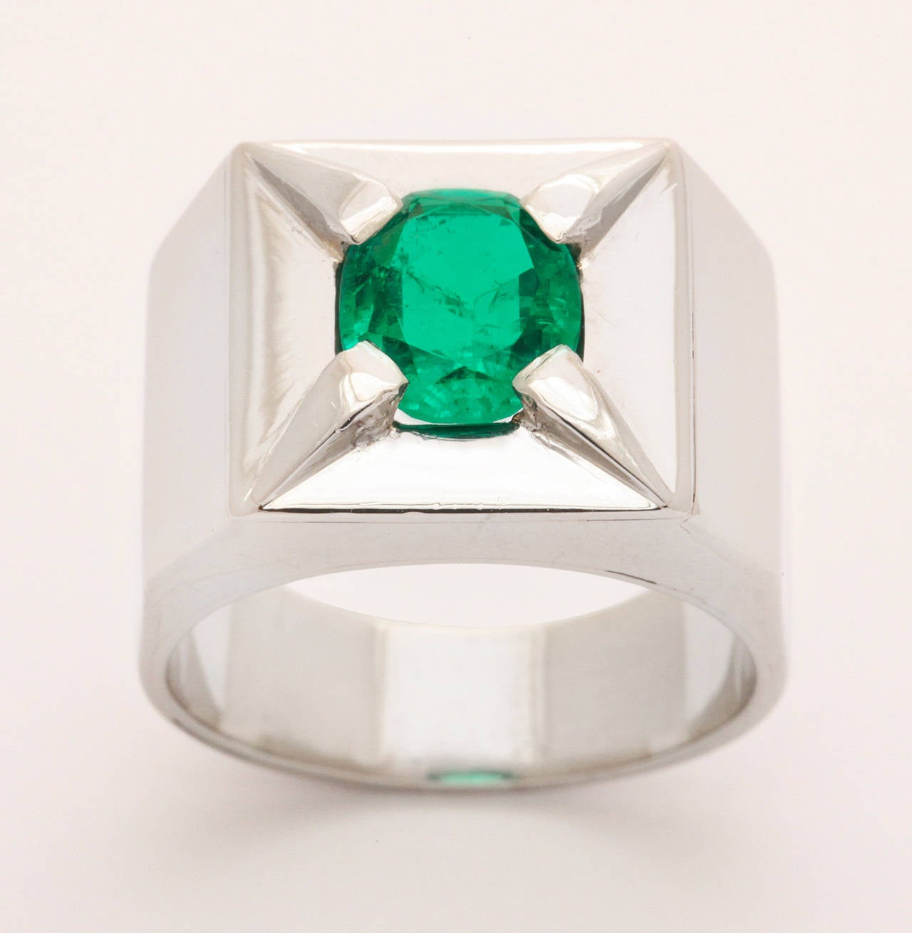 emerald ring in platinum by Suzanne Belperron, center emerald weighs 1.65 carats, circa 1940's.