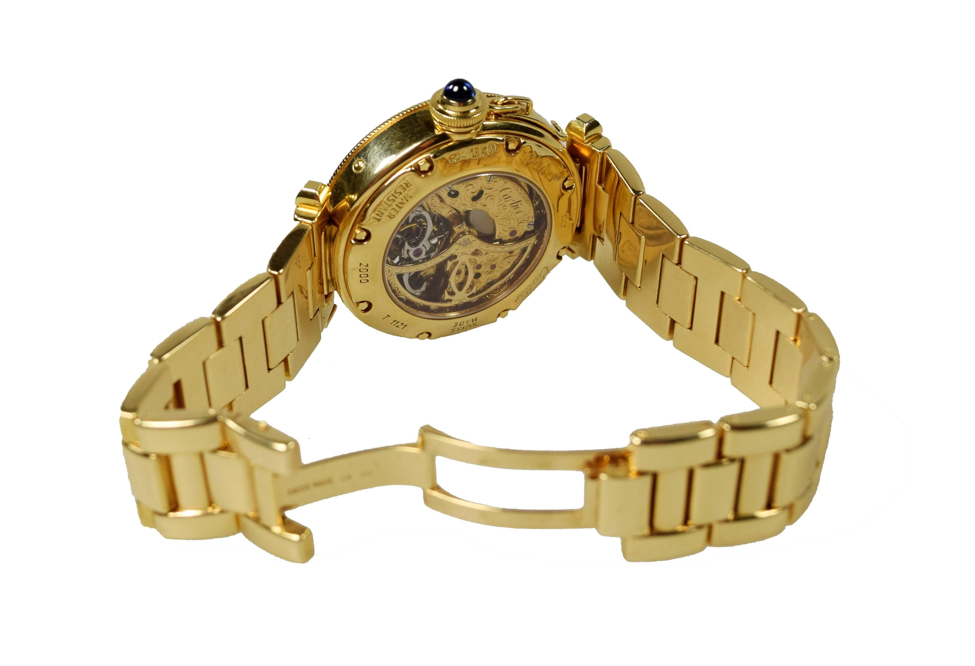 Une montre-bracelet extrêmement rare de Cartier
Modèle Pasha de Cartier 2000 Tourbillon
Tourbillon squeletté avec calendrier perpétuel
Édition limitée
Réalisé par Gerald Genta pour Cartier en 2000
Or jaune avec bracelet en or jaune
Mouvement