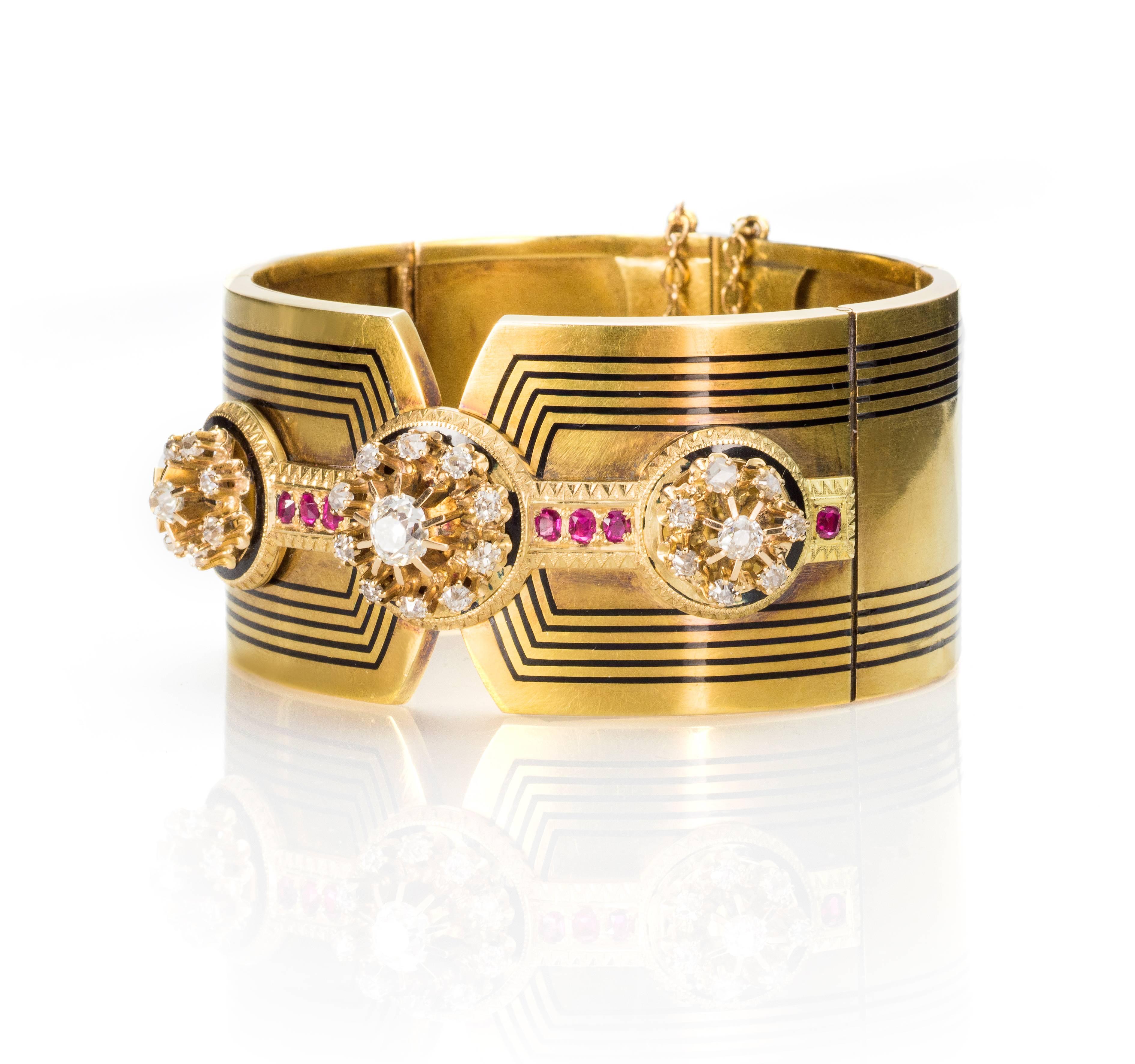 This Exquisite French Bangle Bracelet has a beautiful design reflecting the Charles X period, circa 1830. It´s handmade of Yellow Gold 18 Kts. featuring a three old European-cut diamond clusters at the front, weighing 2´50 carats aprox . It´s