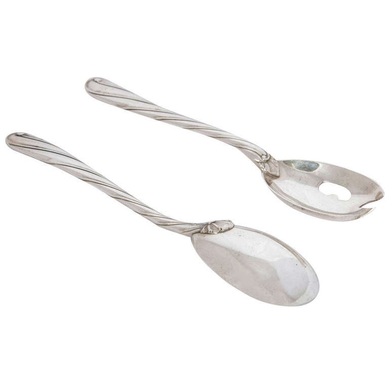 A Pair of Sterling Silver Salad Servers made by Buccelatti of Italy. The pattern is Torchon and the length of each piece is 25cms.