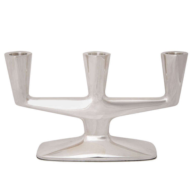 A silver 3-Light Candelabrum made by the German firm of Wilkens in 835 standard silver. The modern design is sleek and understated and it is 13.5cms high and 22.5cms wide.