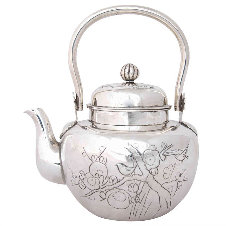 This small Meiji period kettle is a delightful example of Japanese silver. It is 15.5 cms to the top of the handle and weighs 270gms.