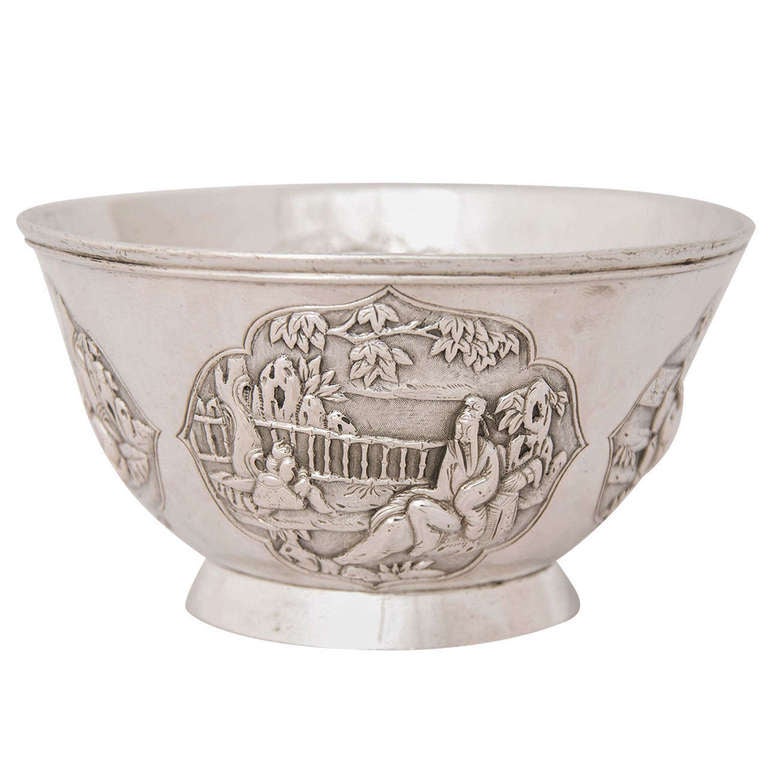 A Chinese Export Silver Bowl marked WS for Woshing and with a second Chinese character mark. The bowl has 4 panels showing two repeated figural scenes and dates from around 1885.
The diameter at the top is 12.8cms and the weight is 211gms.