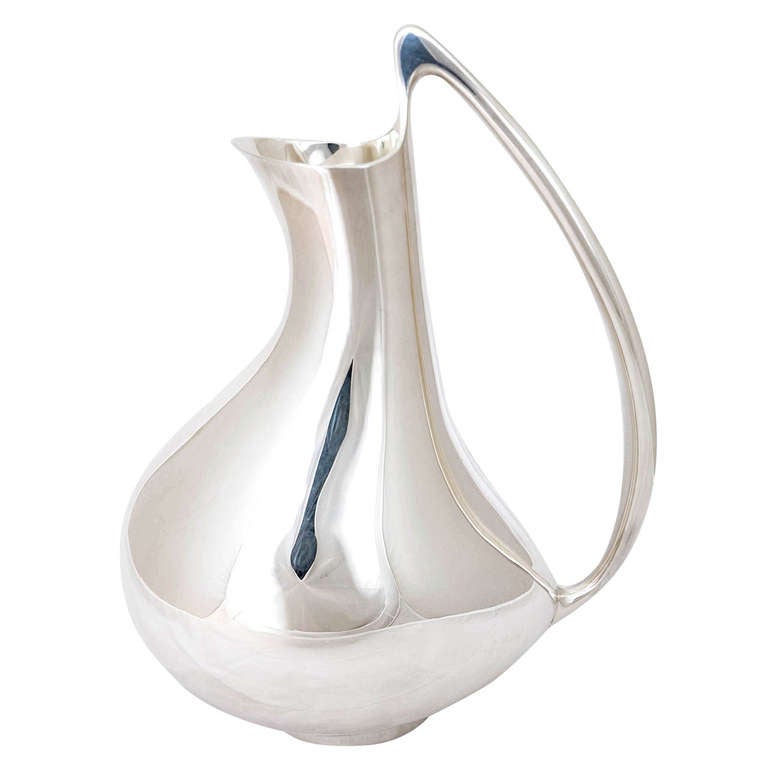 This wonderful jug was designed by Henning Koppel for Georg Jensen in 1951 and almost immediately acquired the nickname of the 