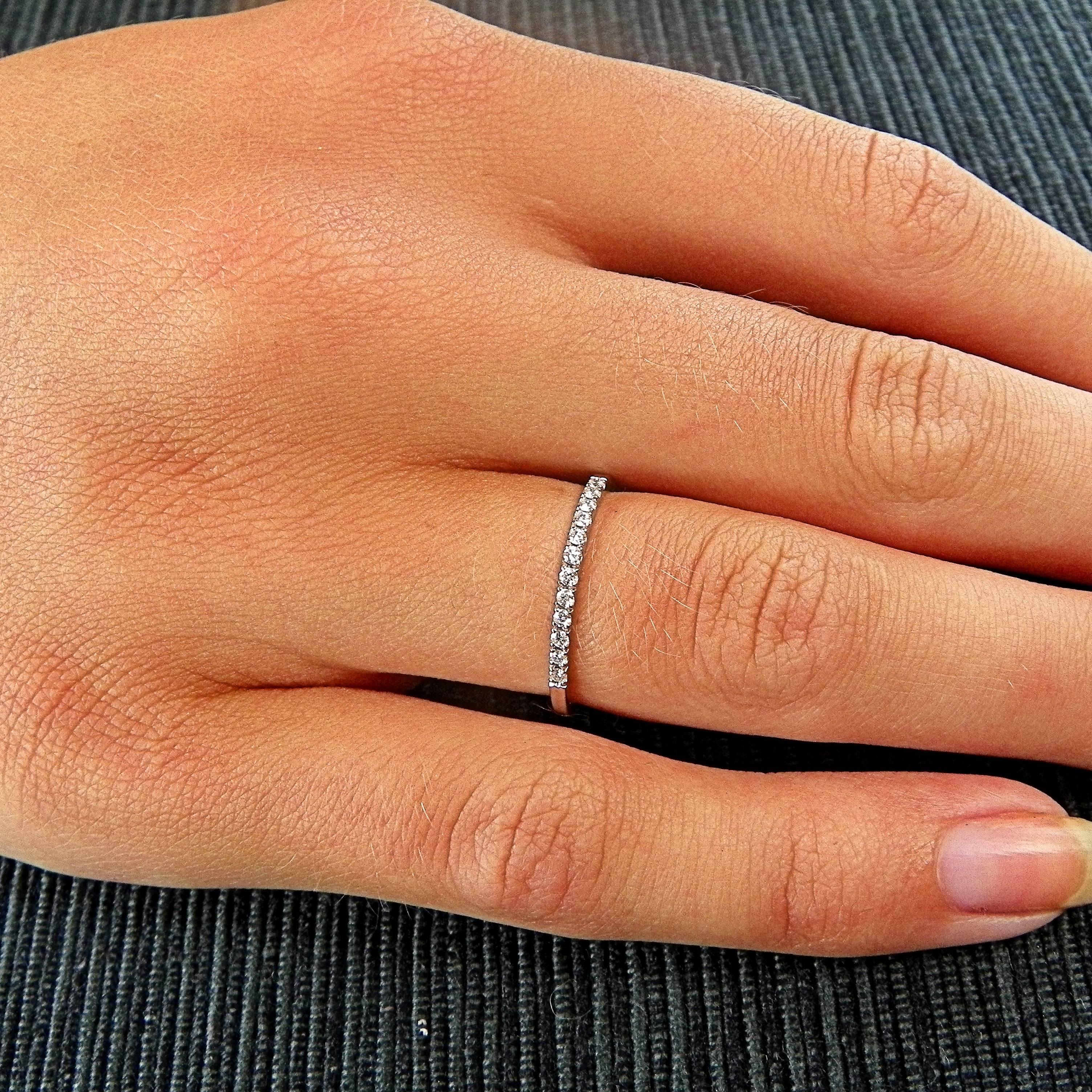 Delicate and very sparkling white Gold 14 K stacking eternity band ring. The ring is set with 12 white round brilliant cut diamonds, for every day wear, alone or with other rings. Easy to combine with other rings. 
0.12 CT, ring size US 7, French