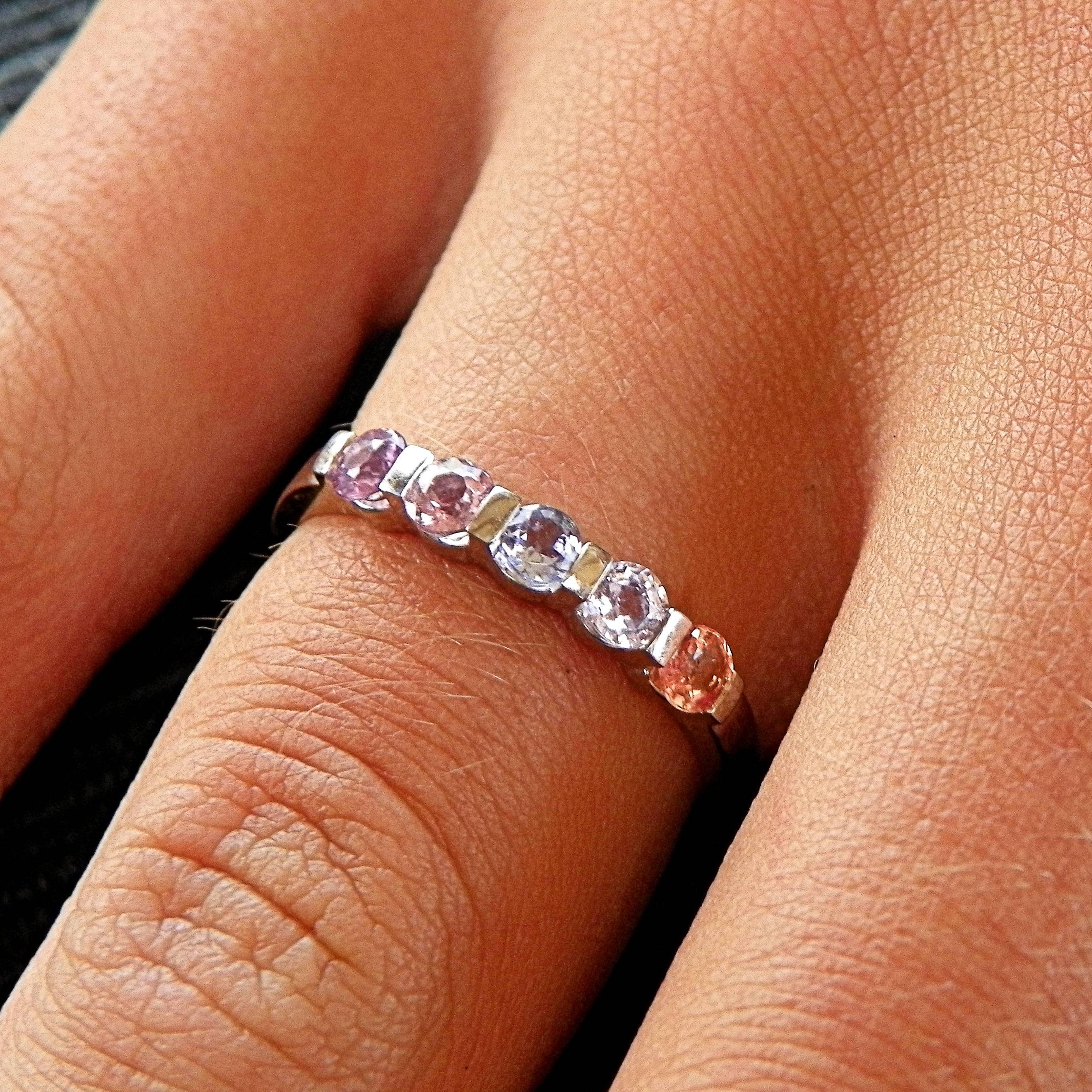 Multicoloured bright Sapphire 14 K White Gold Eternity Stacking Ring with 5 fany light coloured orange, blu and pink sapphires. 
This unique and handmade ring can be worn alone or with other rings and makes the perfect Mother's day gift for a sunny