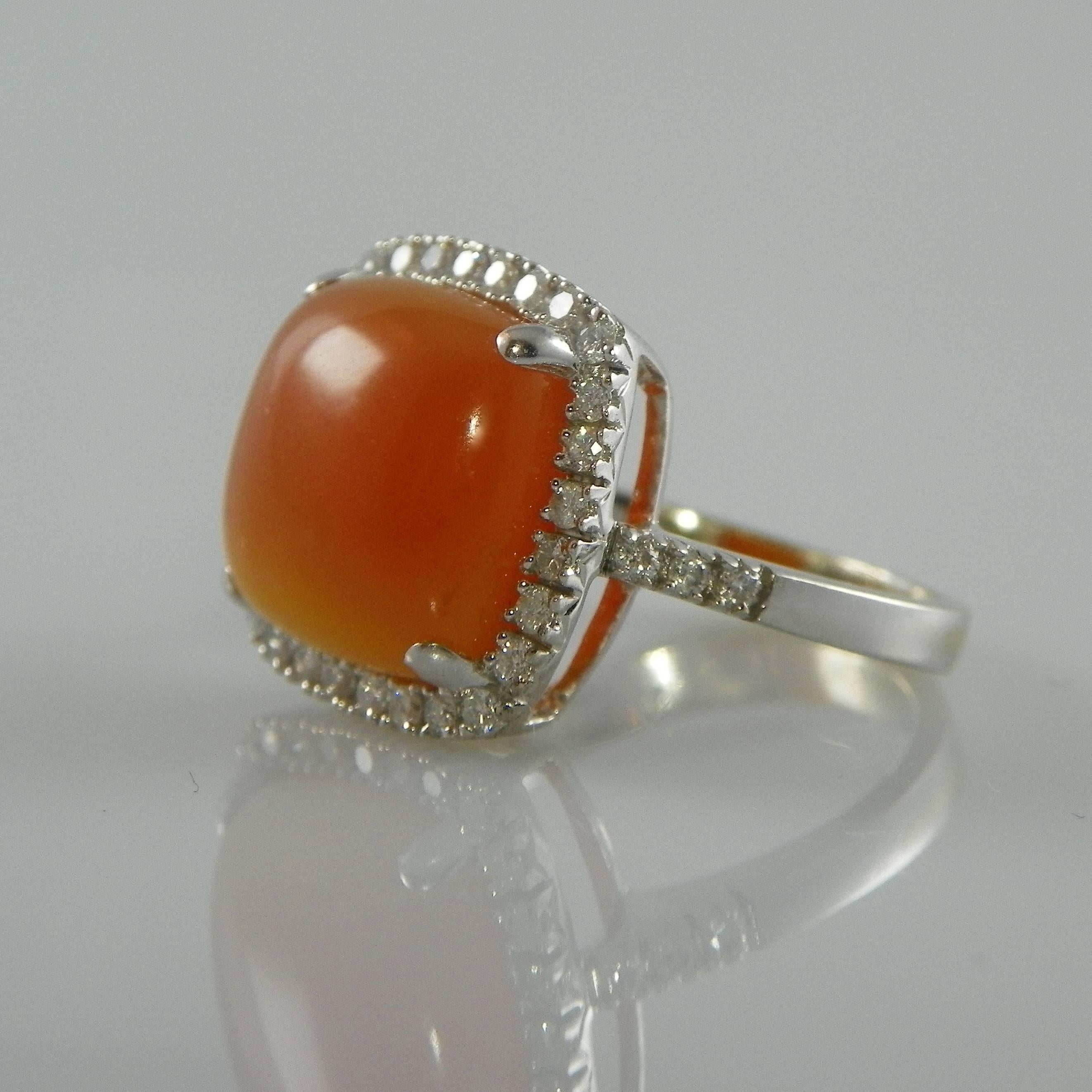 Lovely 14K White Gold Entourage ring with a square orange Chalcedony in a warm color. The stone is set with 34 brilliant cut white diamonds SI quality, in total 0.60 ct. 
Size chalcedony 13mm . Ringsize us 6.75  Eu 54    resizable to most finger